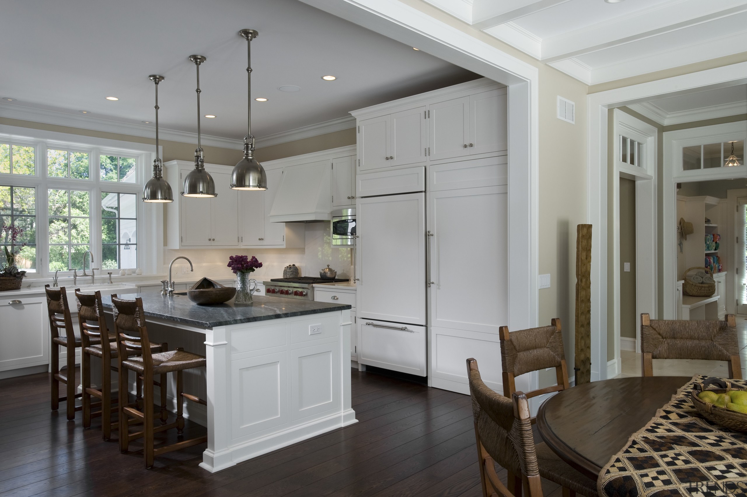 View of kitchen with white cabinetry and island. ceiling, countertop, cuisine classique, floor, home, interior design, kitchen, living room, real estate, room, gray