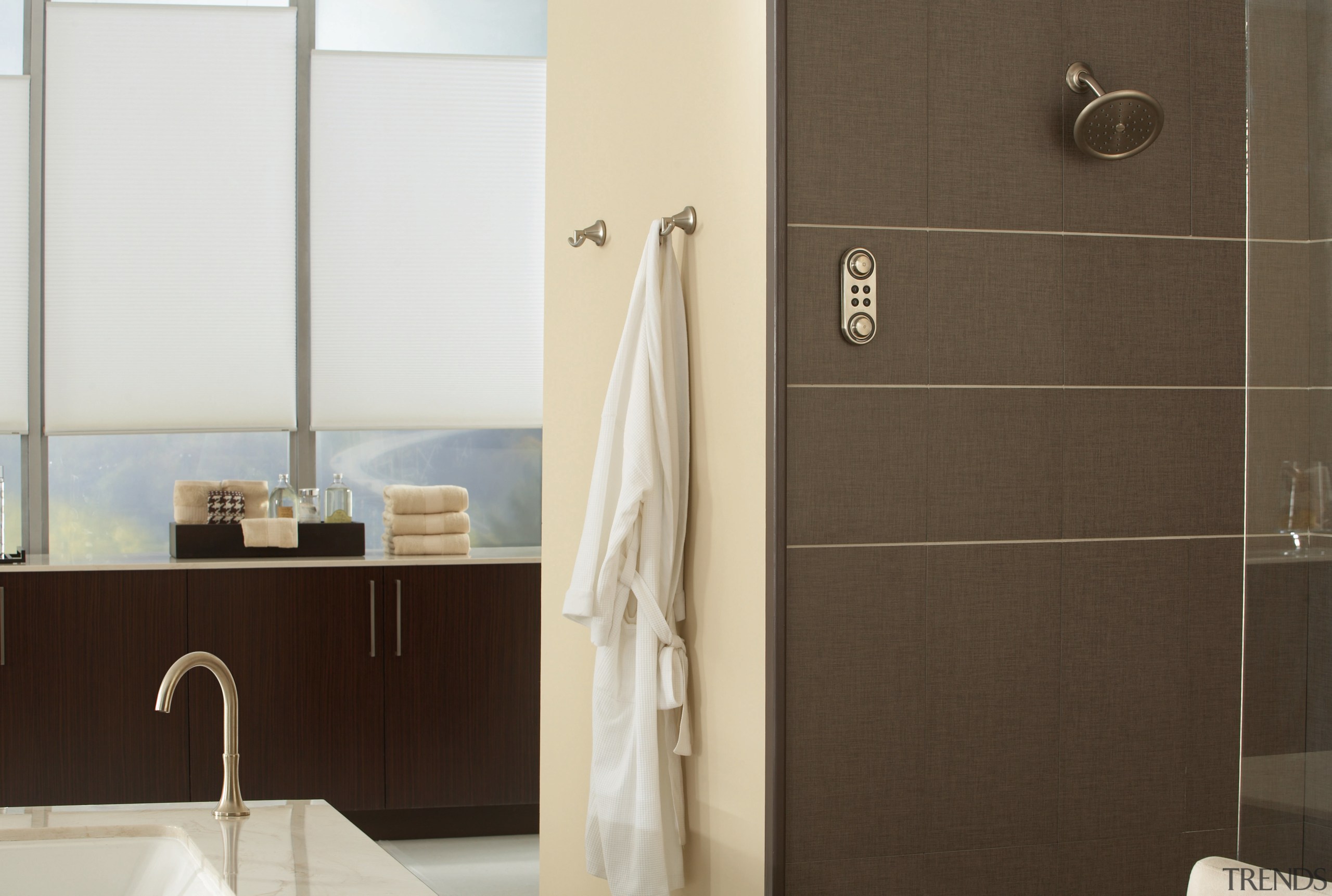 View of a bathroom which features a bathtub bathroom, bathroom accessory, bathroom cabinet, floor, interior design, plumbing fixture, product design, room, tap, black