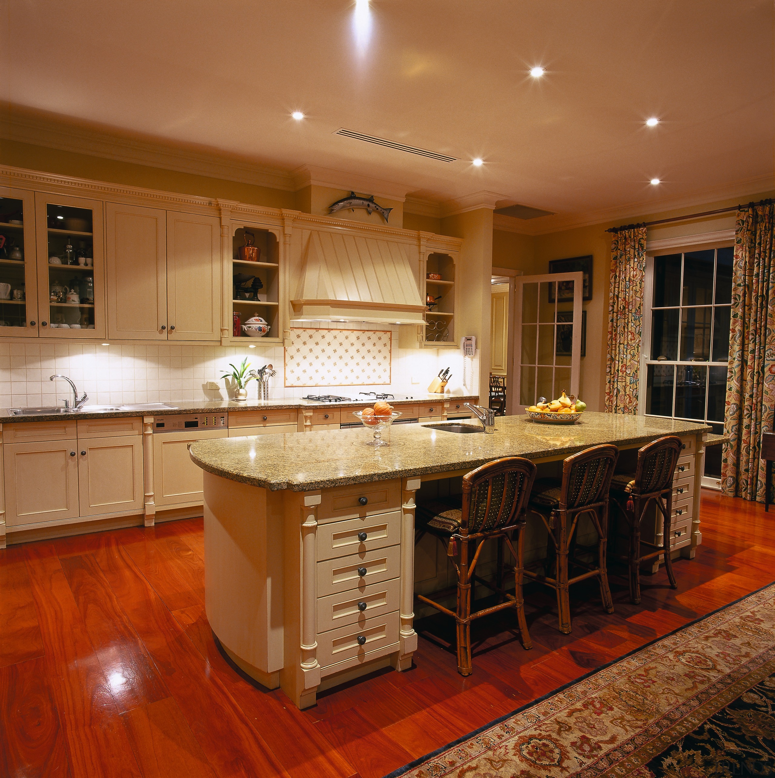 View of the kitchen - View of the cabinetry, ceiling, countertop, cuisine classique, floor, flooring, hardwood, home, interior design, kitchen, real estate, room, table, under cabinet lighting, wood, wood flooring, brown