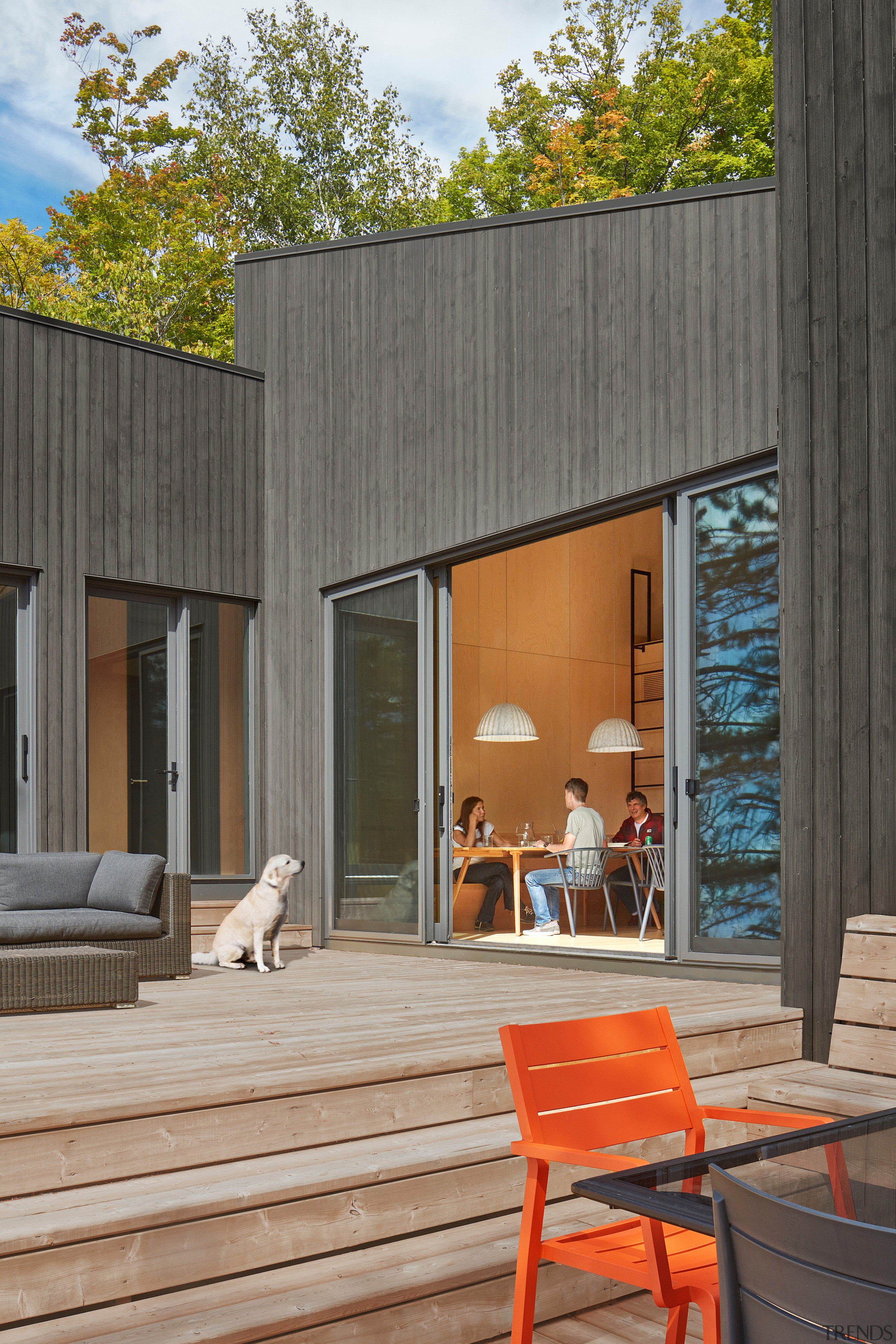 An expansive deck stretches along the cottage’s lakeside 