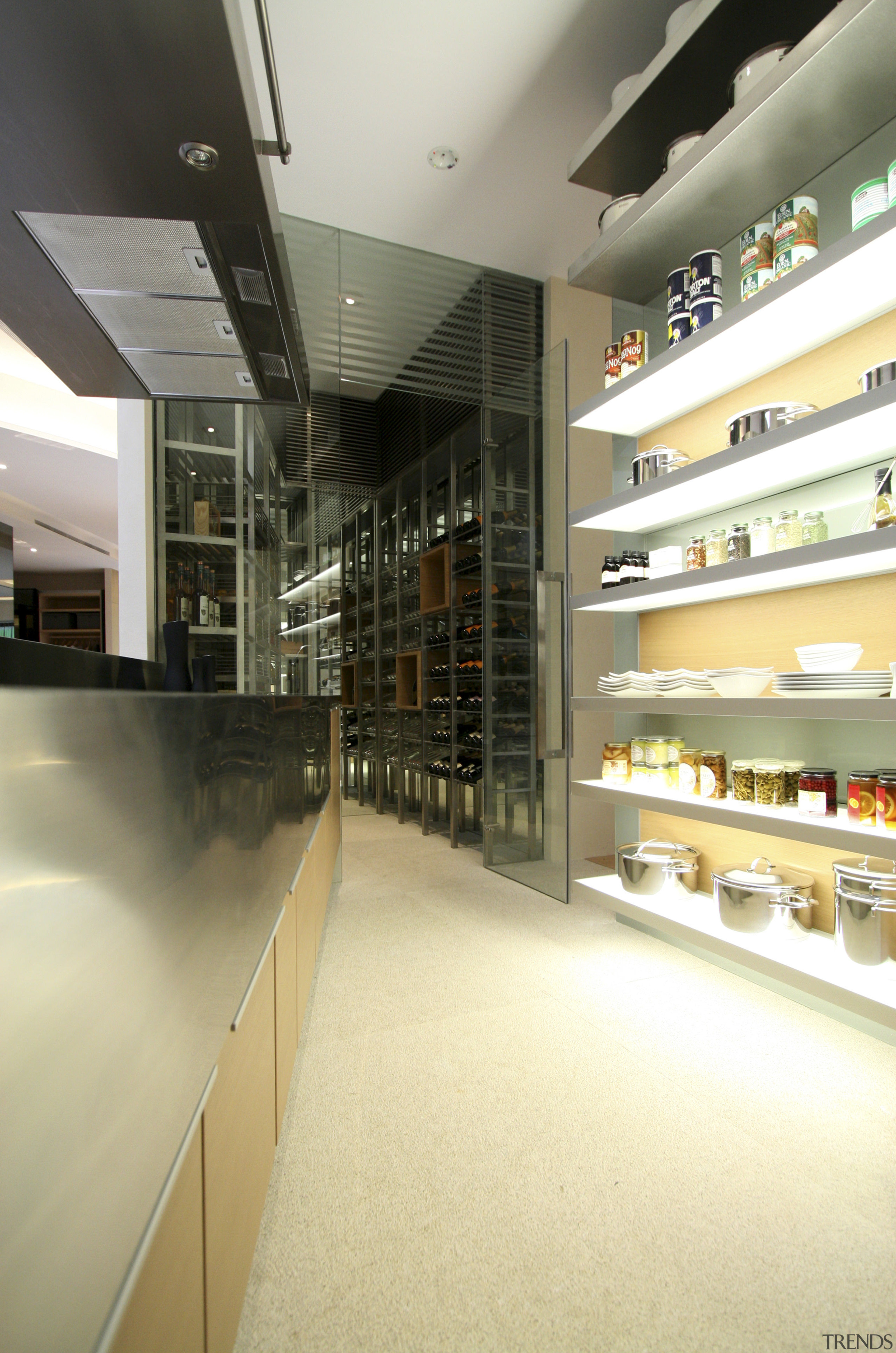 View of wet kitchen featuring large rangehood and glass, interior design, yellow