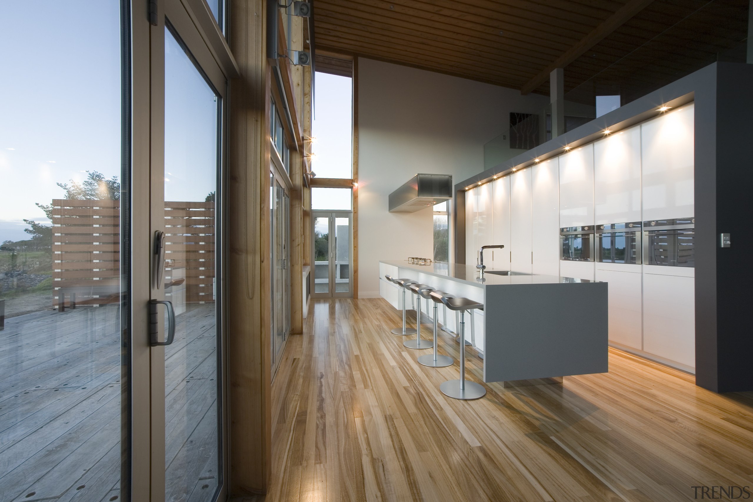 View of a kitchen designed by NKBA designer apartment, architecture, daylighting, floor, flooring, hardwood, house, interior design, loft, real estate, wood, wood flooring, brown