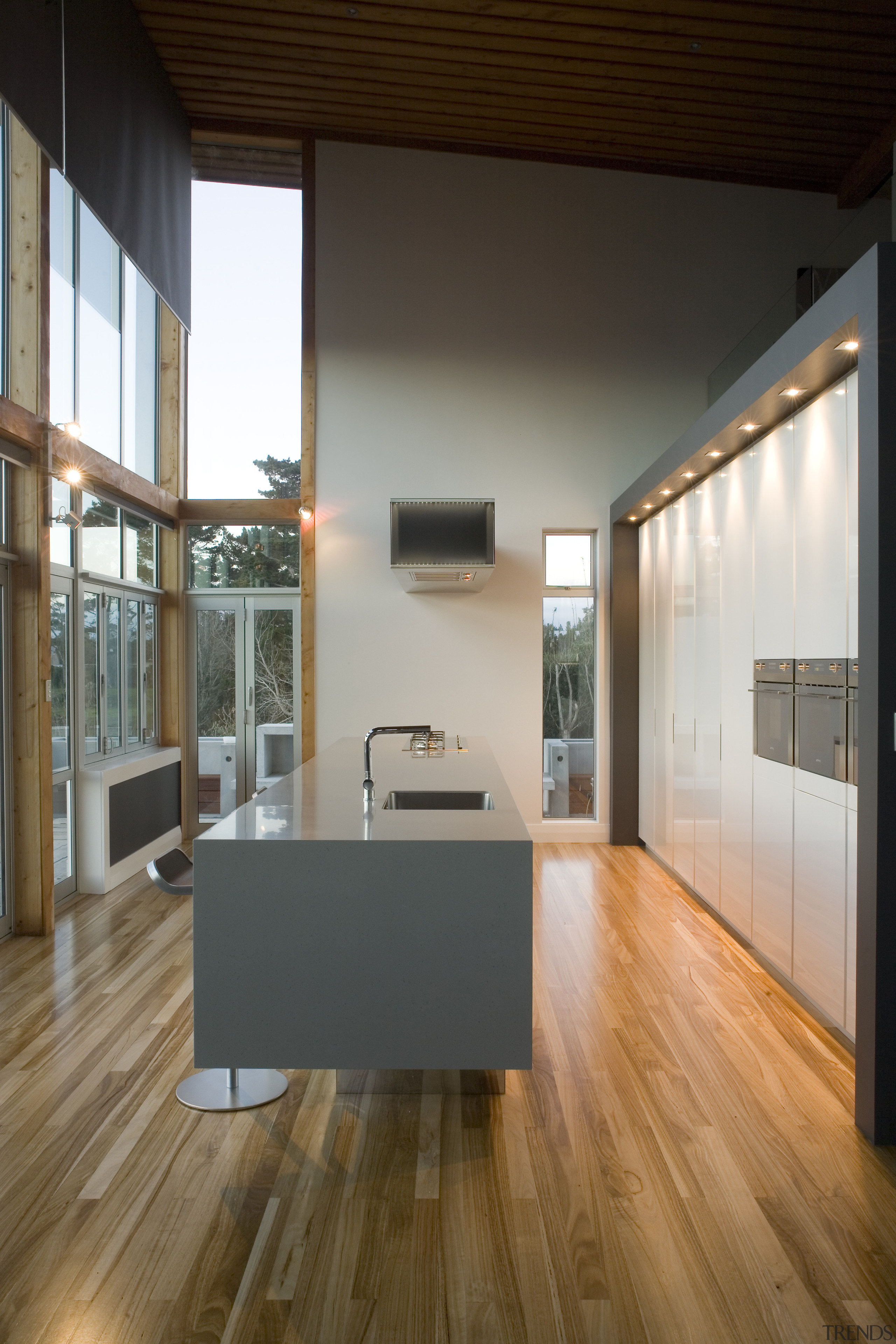 View of kitchen which features timber flooring, bar architecture, ceiling, daylighting, floor, flooring, hardwood, house, interior design, laminate flooring, living room, loft, wood, wood flooring, brown, gray, black