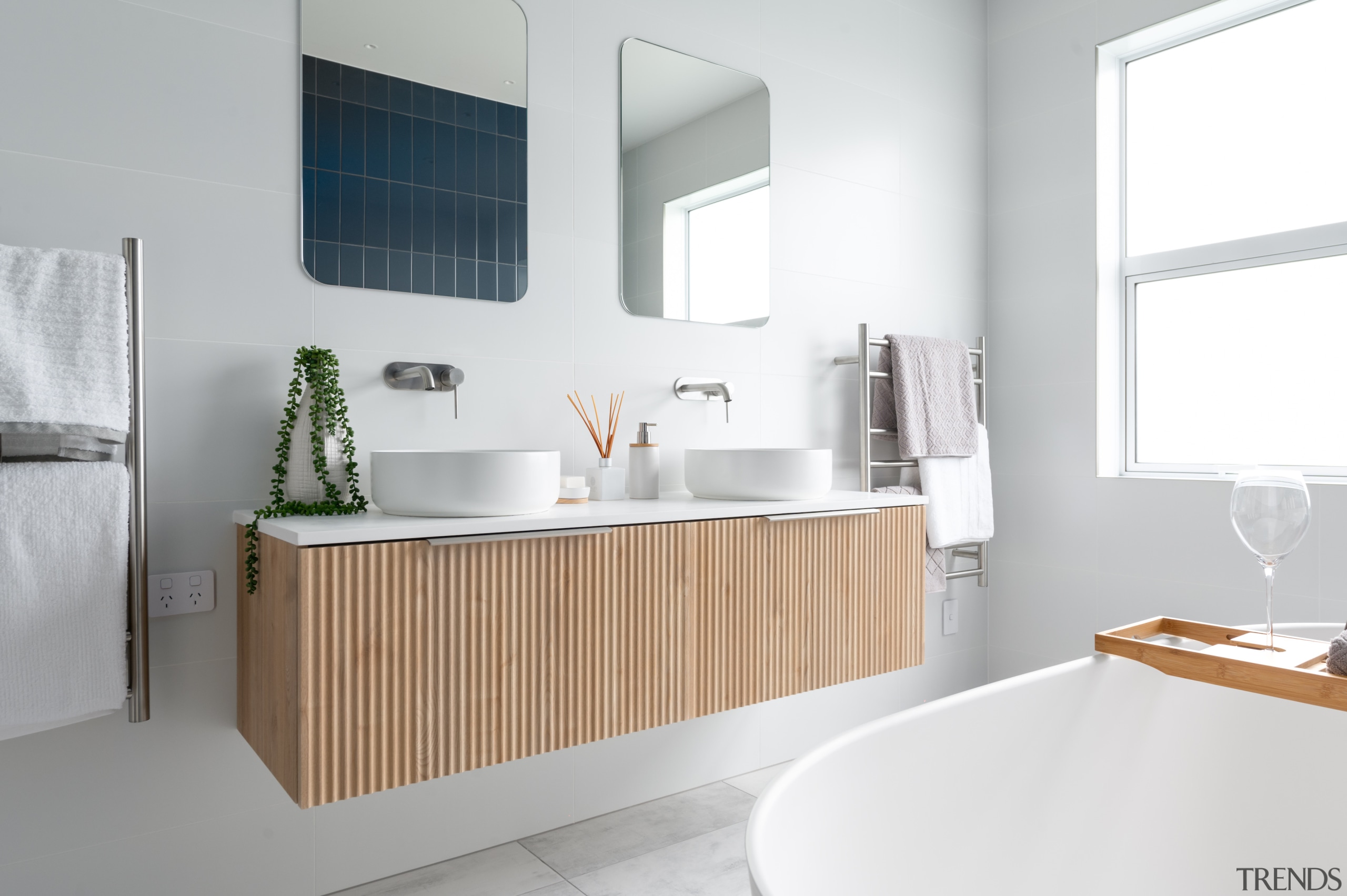 The main bathroom has a ribbed designer vanity 