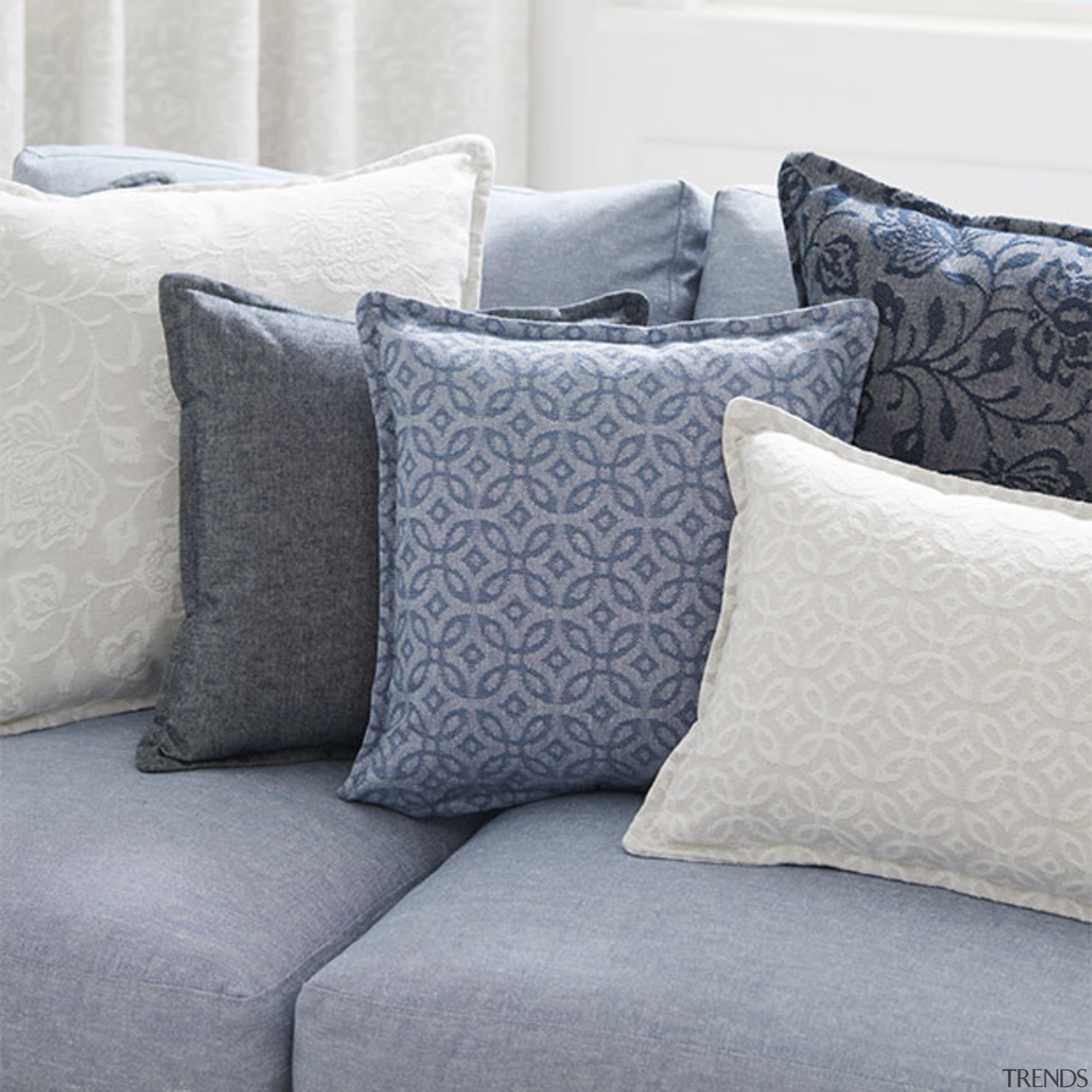 Offering a calm coastal aesthetic and soft tactile bed, bed frame, bed sheet, bedding, couch, cushion, duvet cover, furniture, linens, pillow, product, textile, throw pillow, gray, white