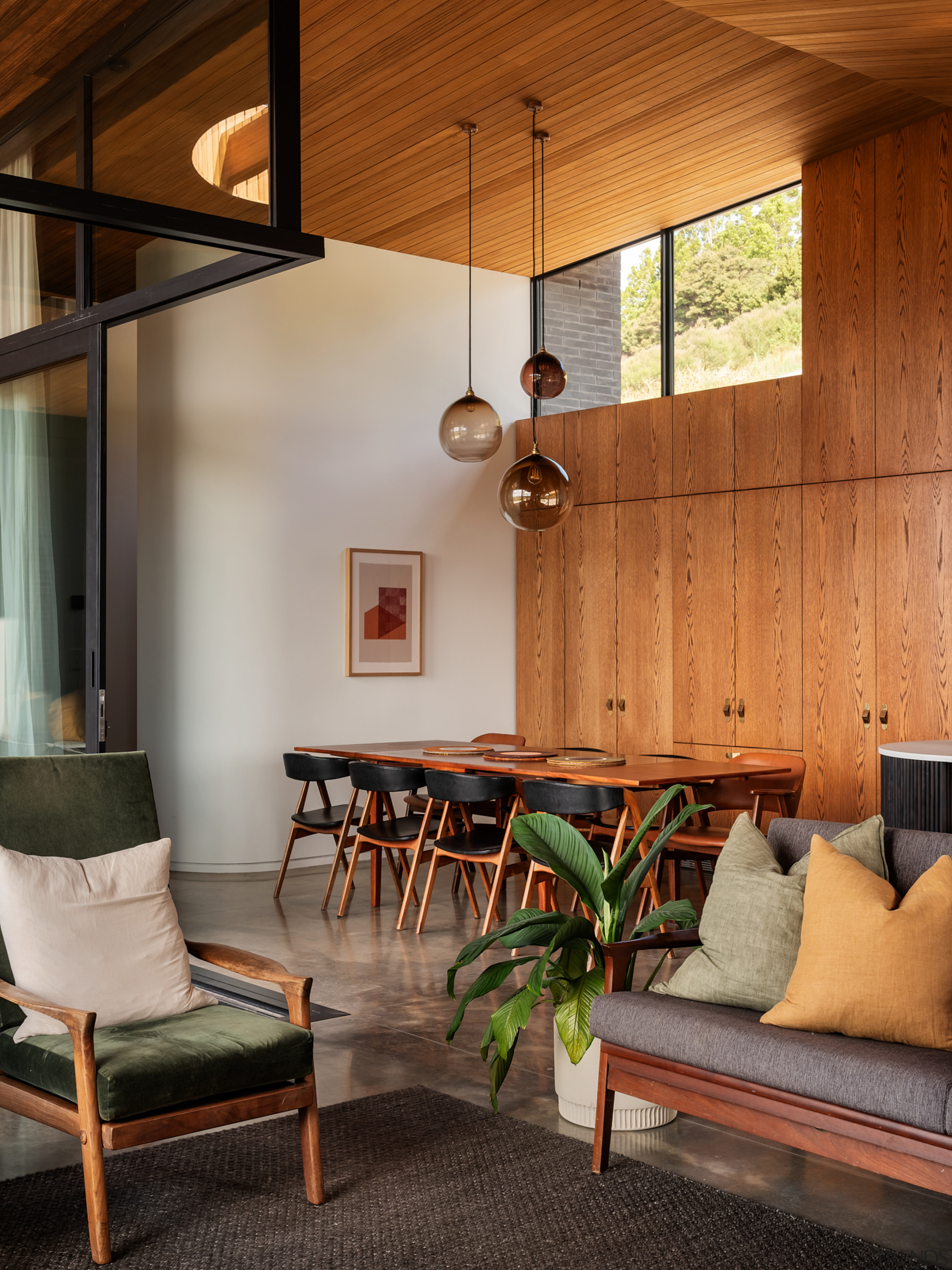 Dining area with a wall of cabinetry behind. 