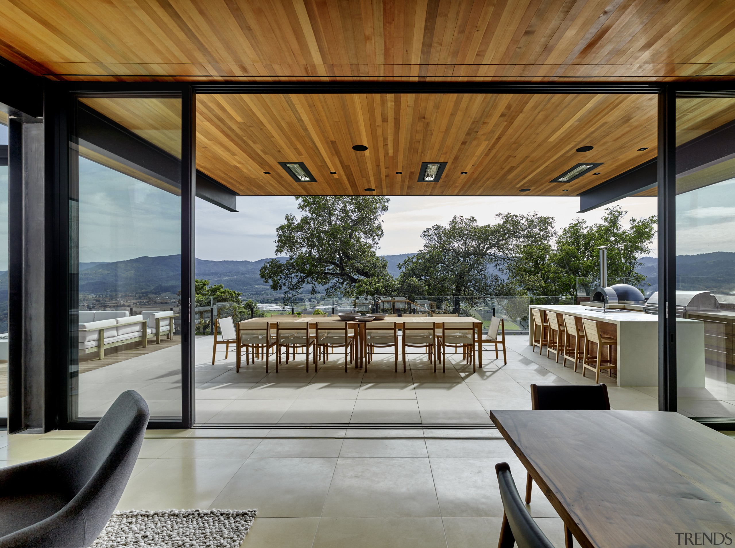 Views across the valley predominate in the living architecture, deck, design, floor, tiles, furniture, home, house, interior design, living room, patio, porch, shade, table, window, wood, tiles,  floor, de Vito Design + construction