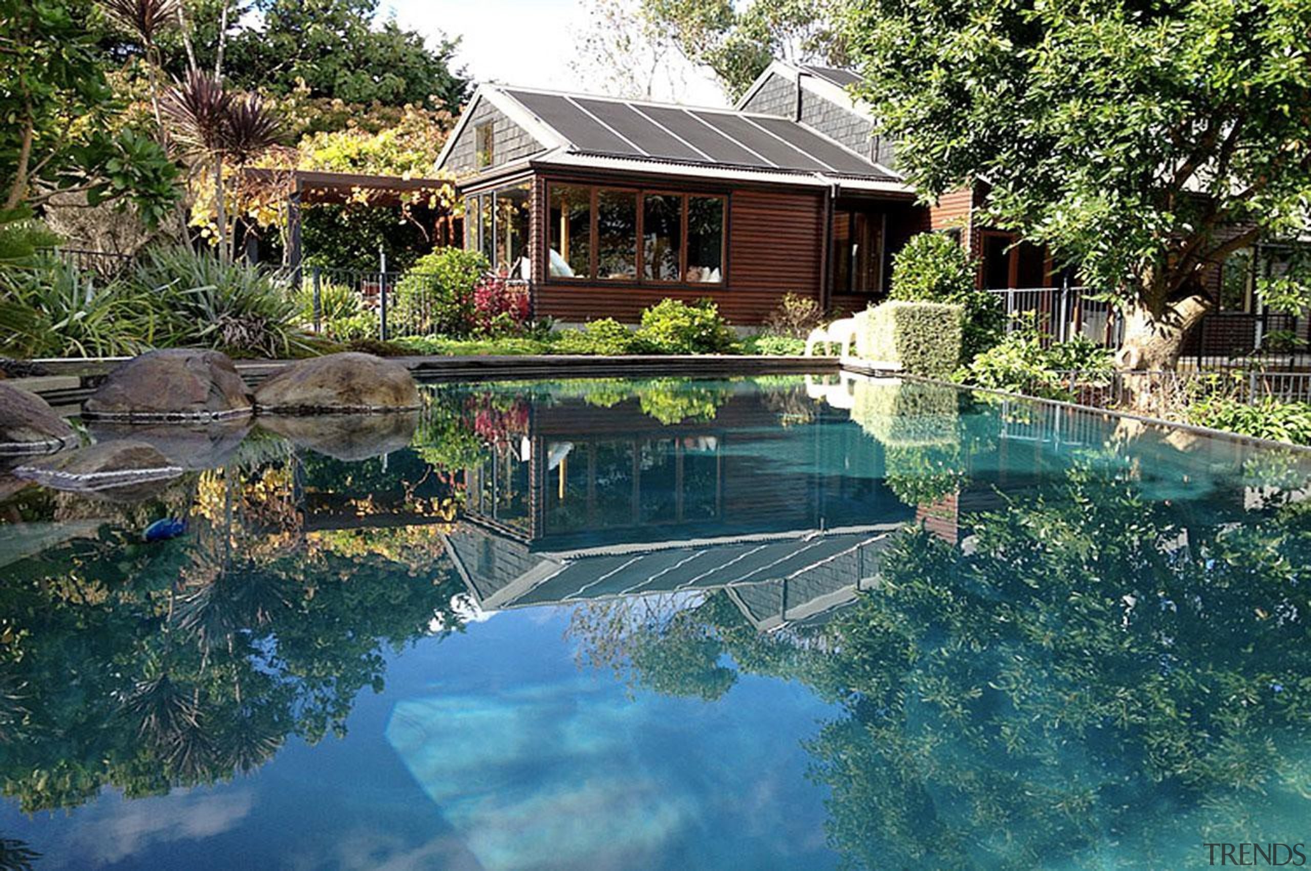 Gold Award recipient for Refurbished or Renovated Residential backyard, cottage, estate, home, house, landscape, leisure, nature, outdoor structure, plant, pond, property, real estate, reflection, resort, swimming pool, tree, water, teal