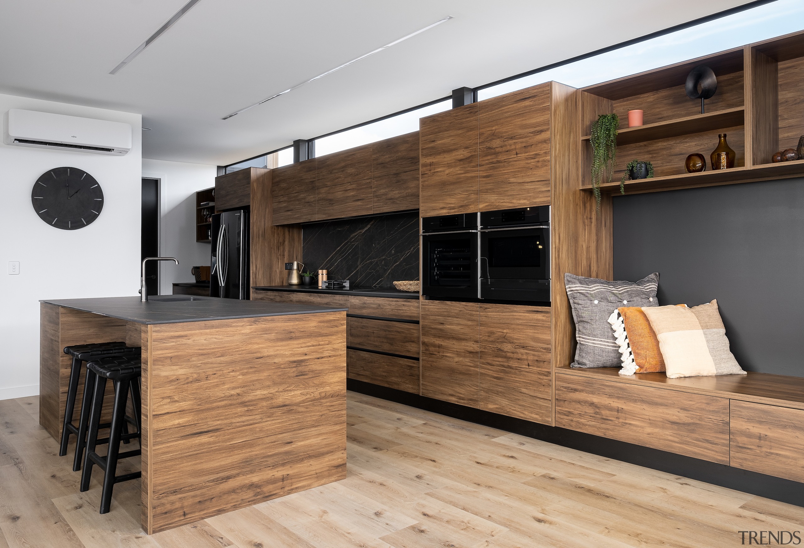 The substantial timber kitchen cabinetry is matched with 