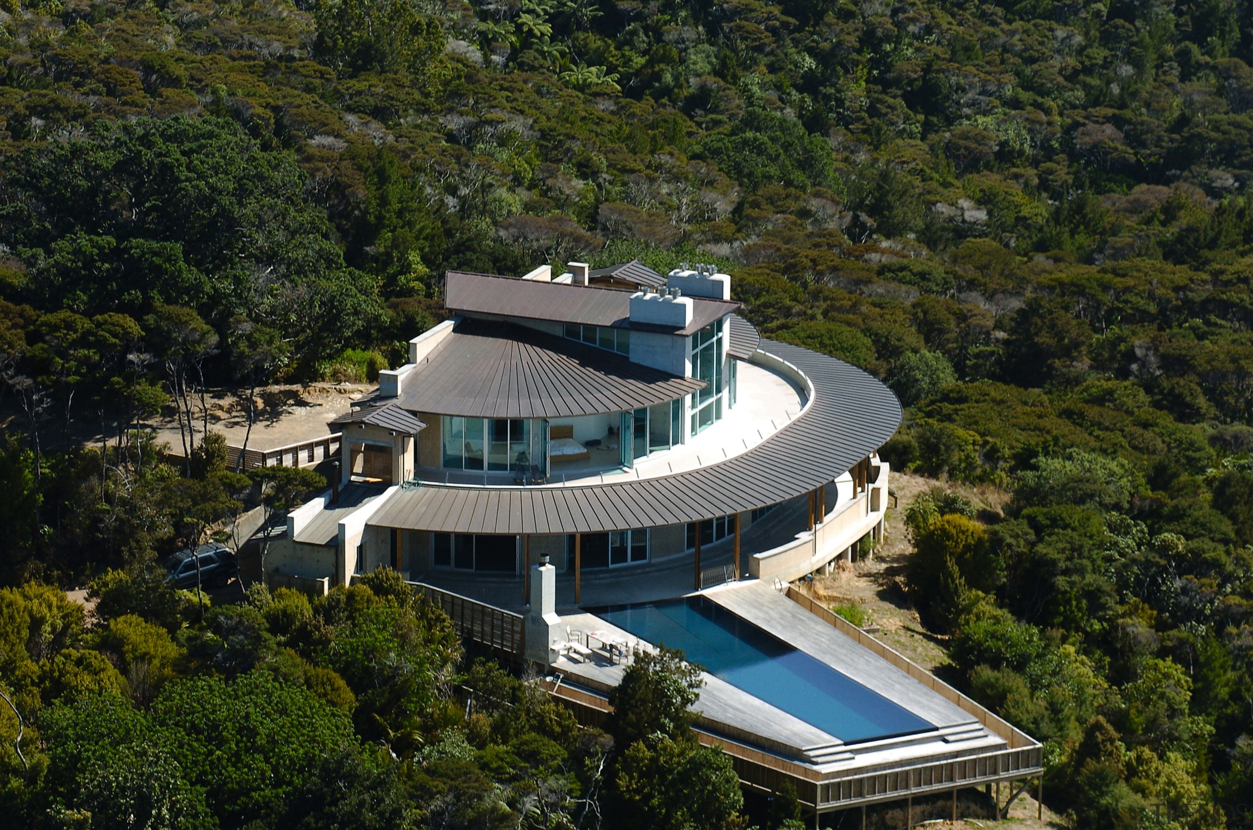 A high shot of a large cliff top aerial photography, architecture, bird's eye view, building, estate, home, house, mansion, property, real estate, roof, tree, brown, black