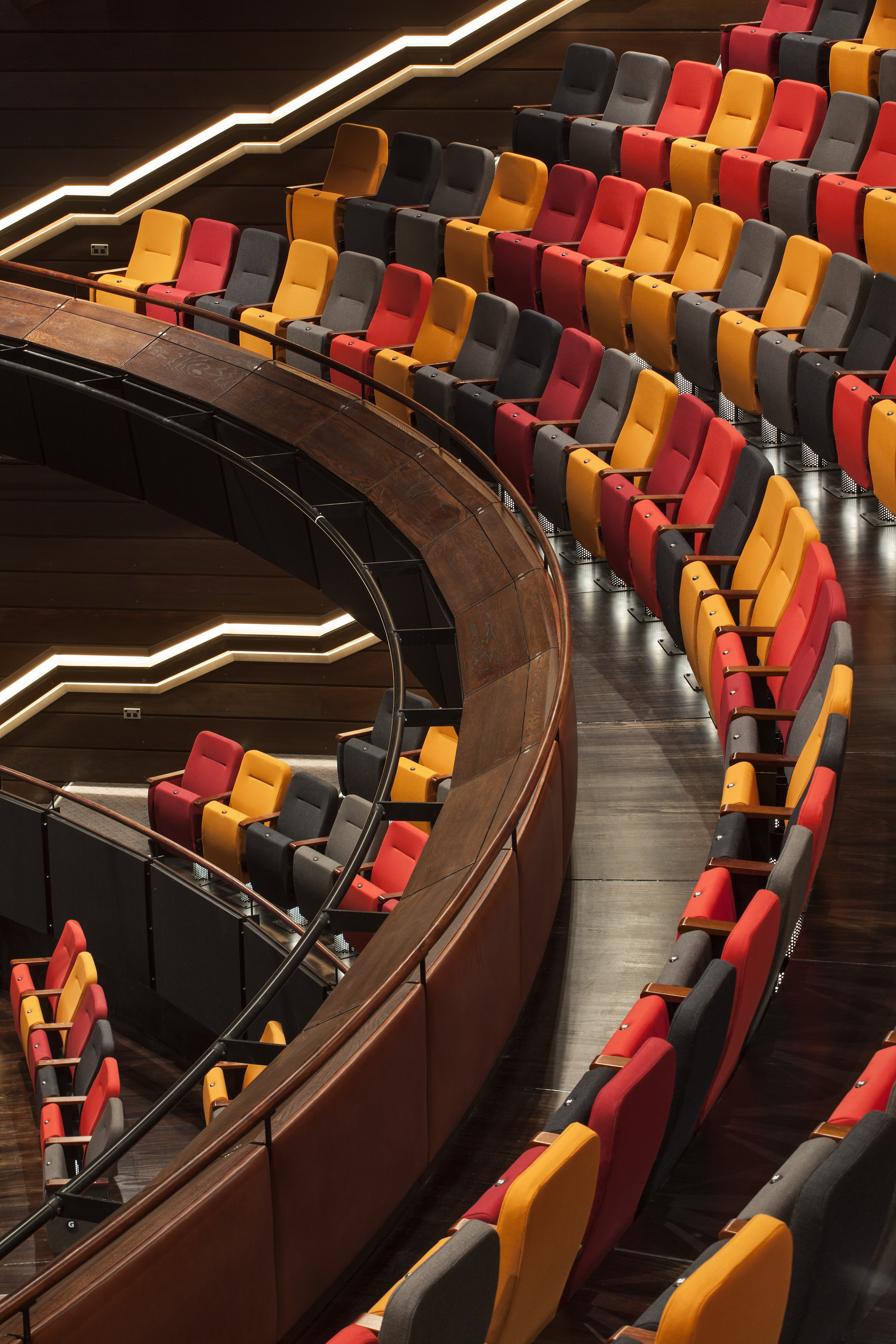 Rather than the usual monotone theatre seating colour, auditorium, theatre, yellow, red, black