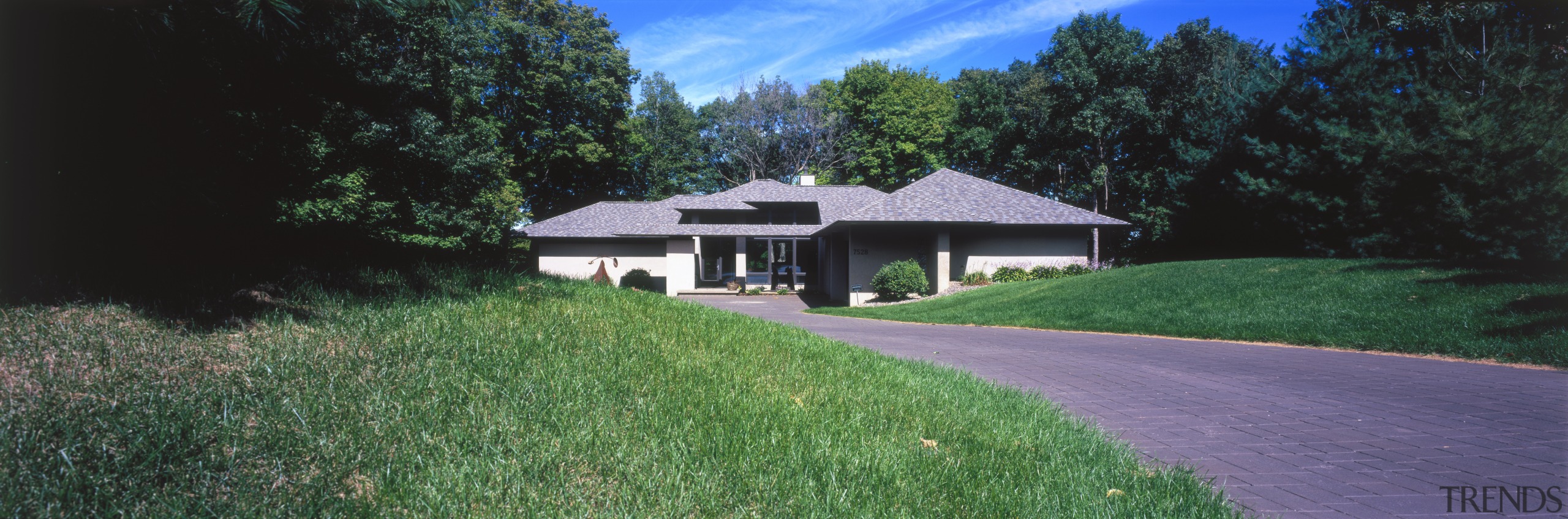 View of a house designed by Charles R asphalt, cottage, estate, farmhouse, grass, home, house, land lot, landscape, lawn, path, plant, plantation, property, real estate, residential area, roof, sky, suburb, tree, black