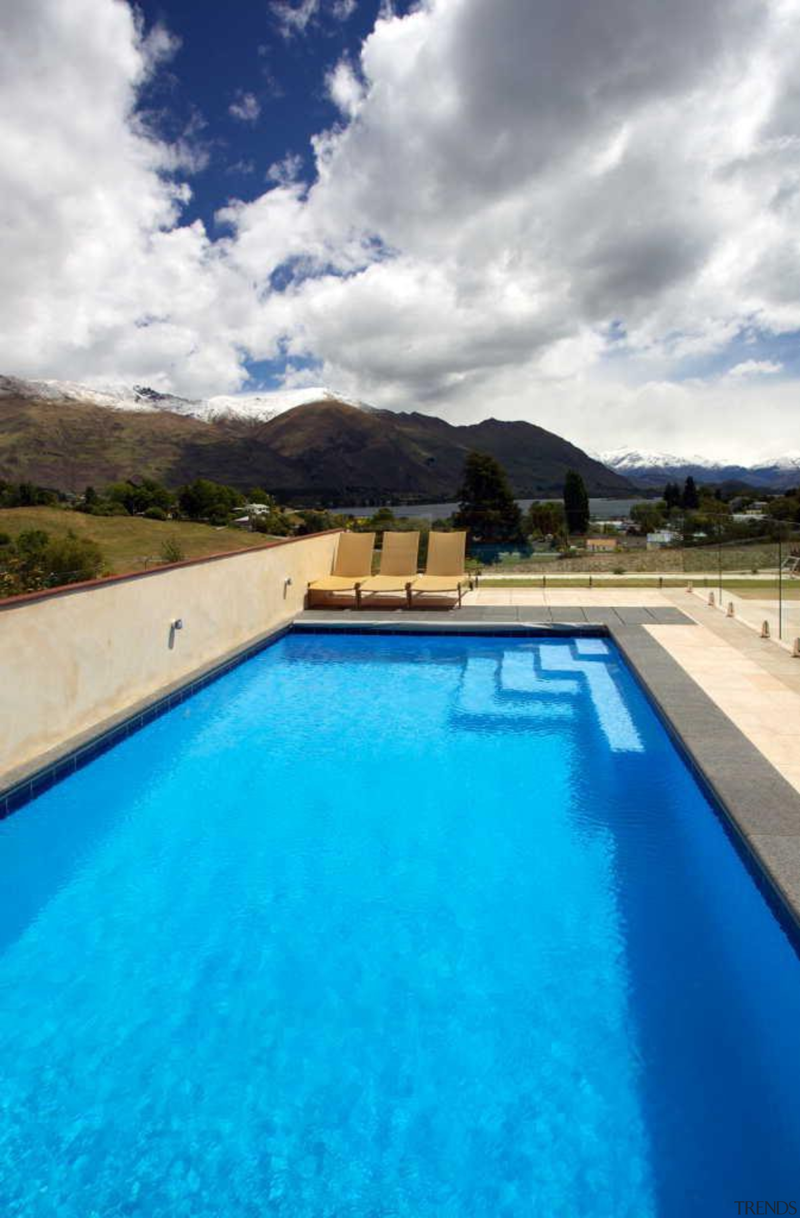 This pool by Mayfair Pools laps against the cloud, estate, leisure, property, real estate, sky, swimming pool, water, teal