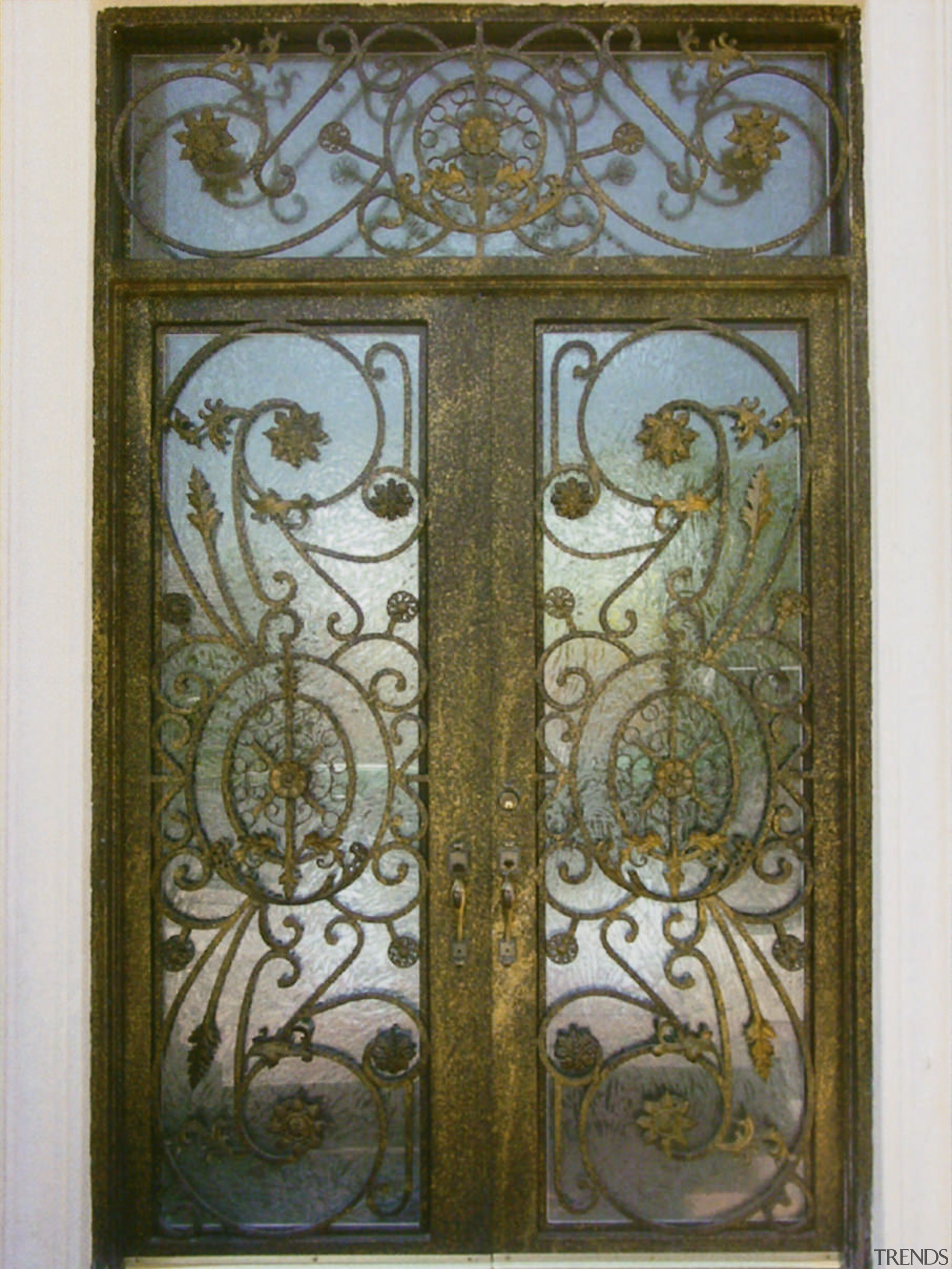 Close up view of a wooden door with door, glass, iron, metal, brown, gray