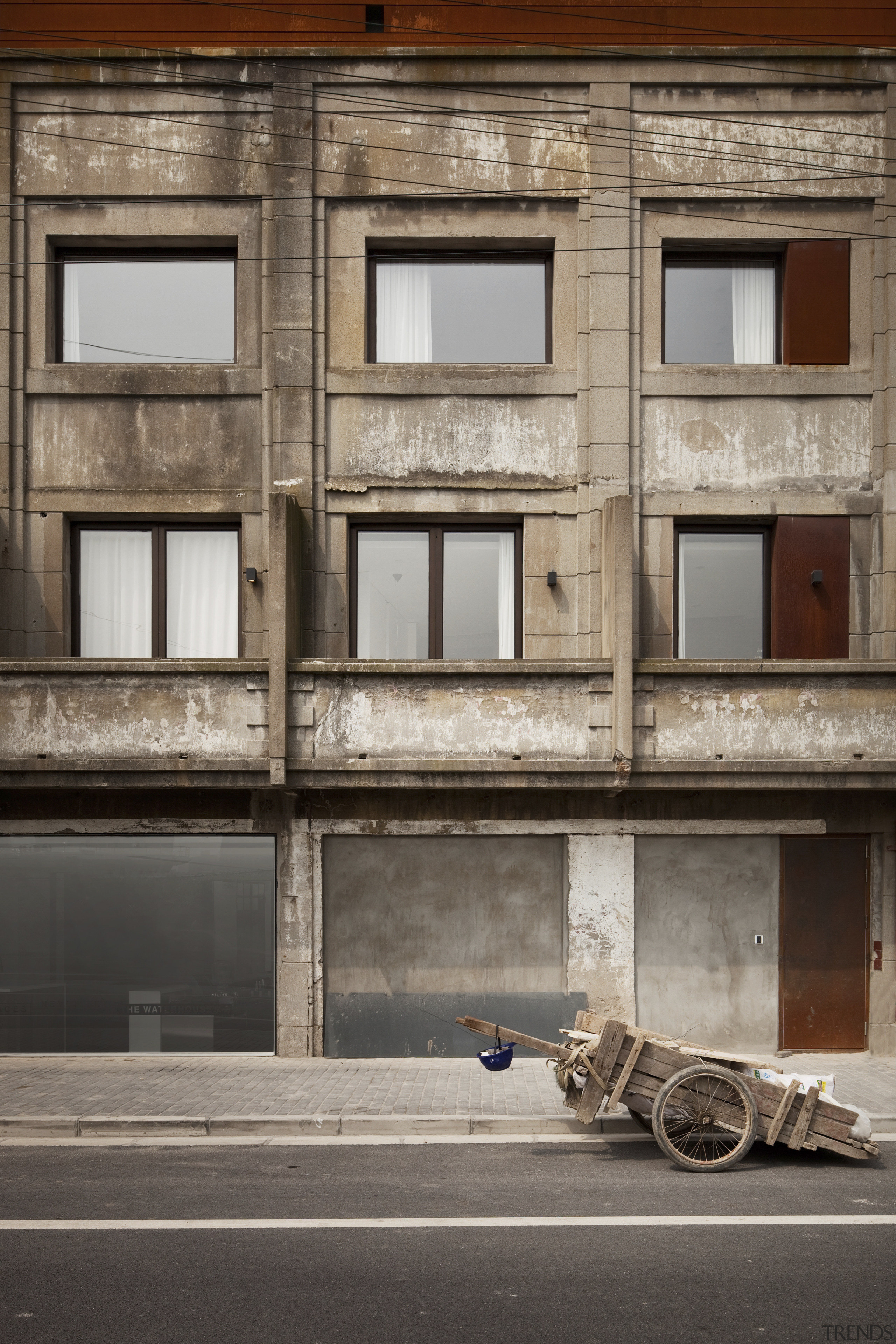 View of a contemporary boutique hotel in Shanghai. architecture, building, door, facade, house, wall, window, gray