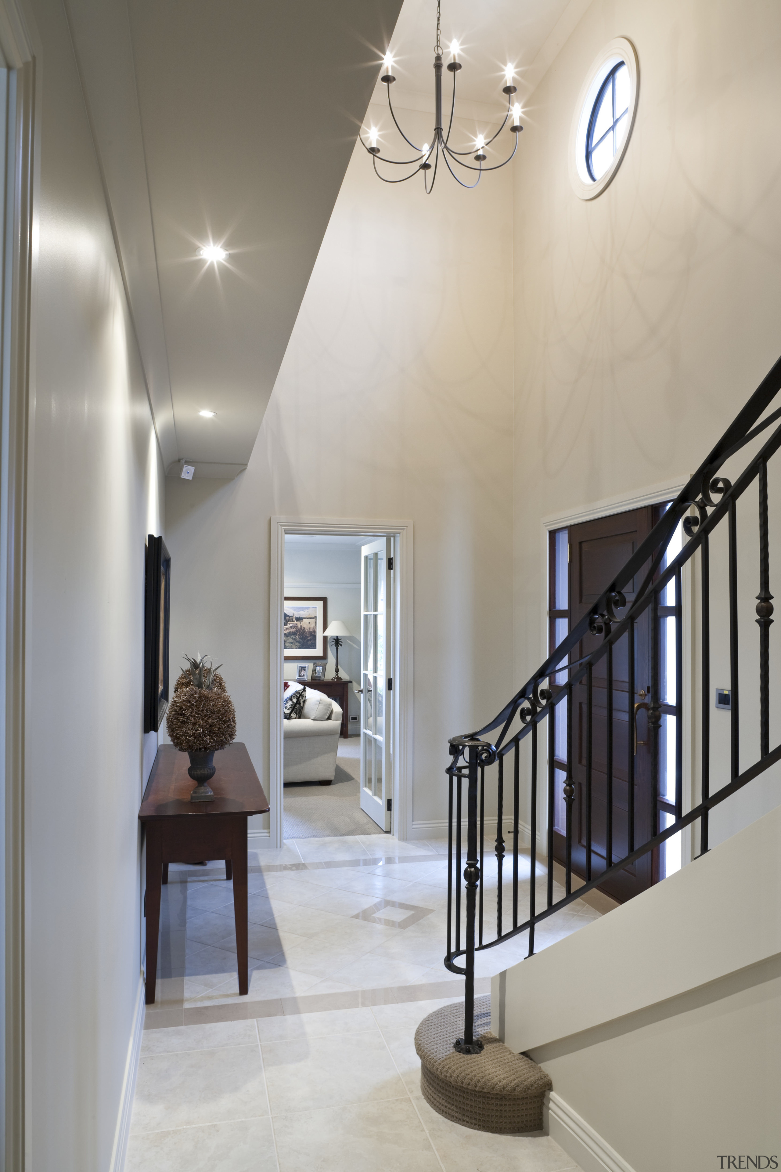 View of stairway which features iron balustrade and architecture, baluster, ceiling, daylighting, estate, floor, hall, handrail, home, interior design, light fixture, stairs, wall, gray