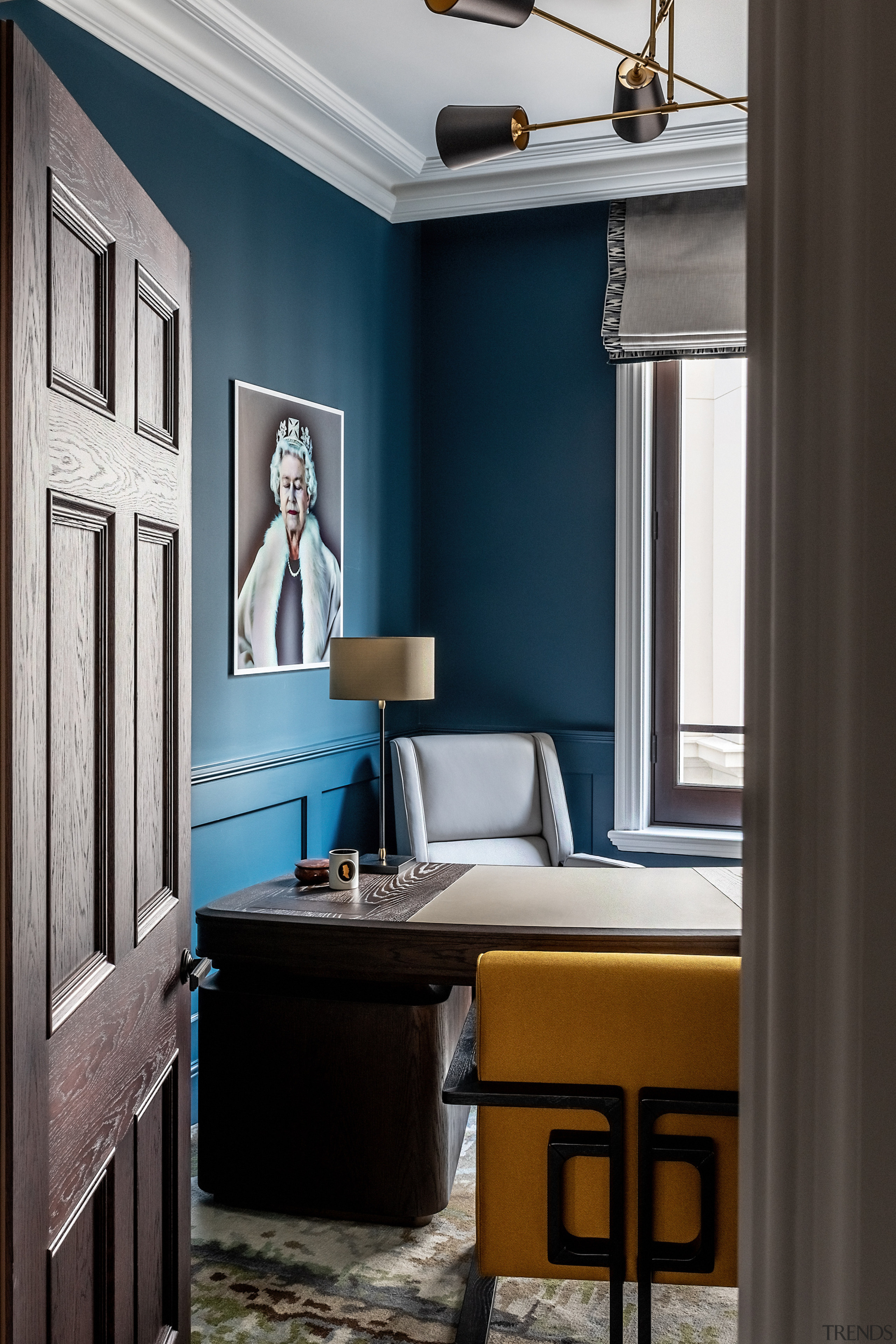 A Theodore Alexander desk features in the study 