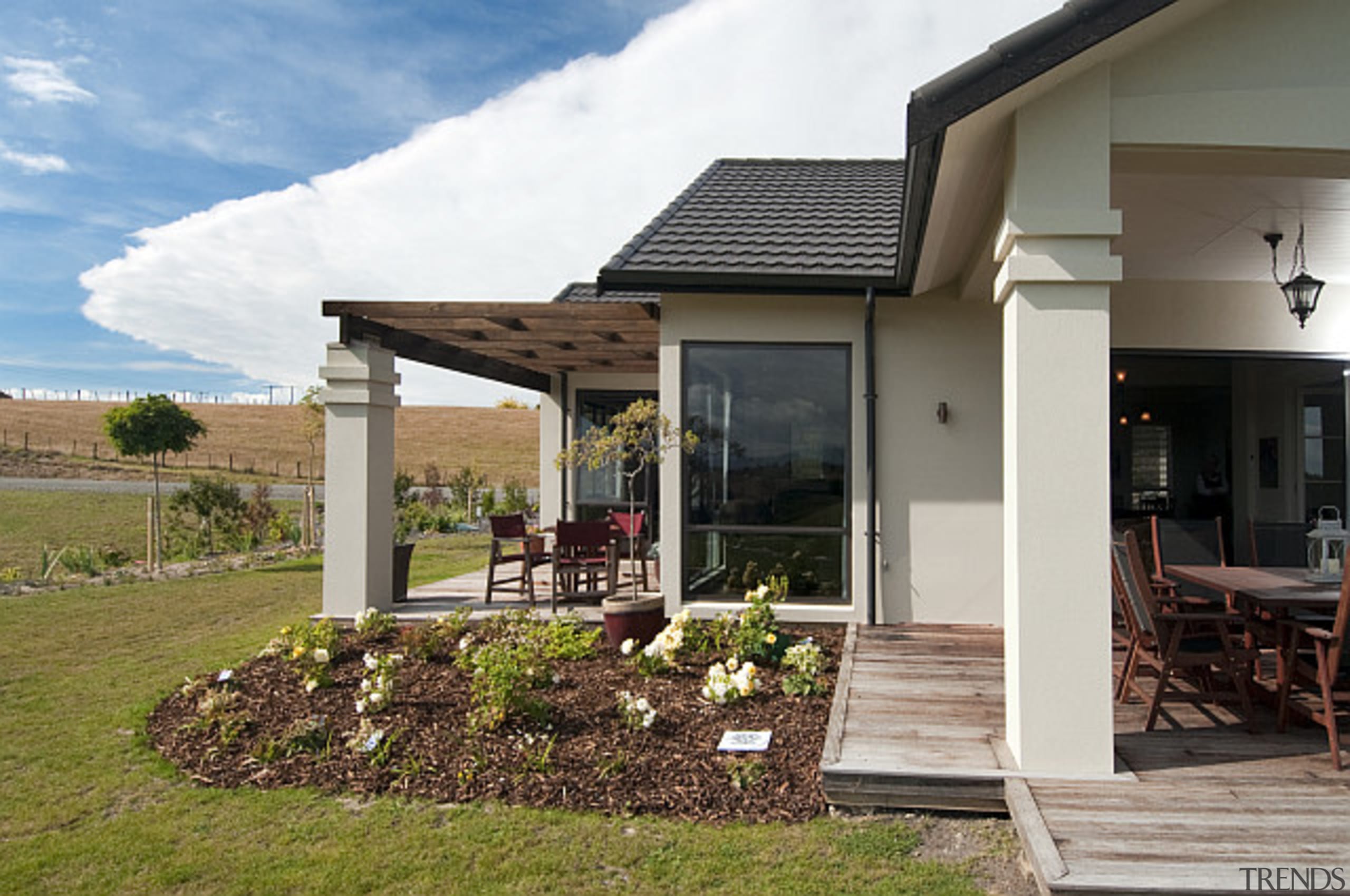 Multiple outdoor spaces in this home built by cottage, home, house, outdoor structure, property, real estate, brown