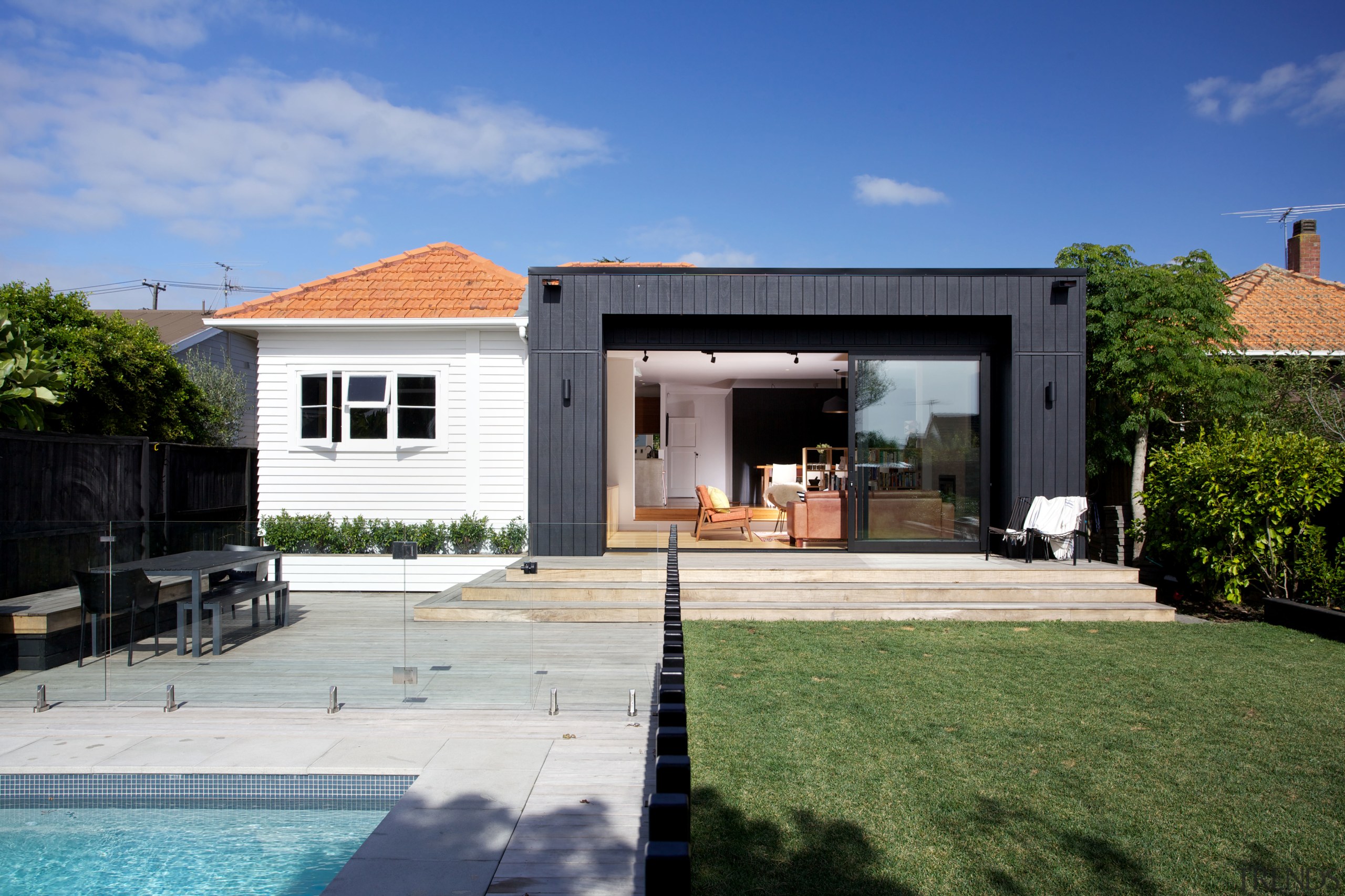 Theres no disguising the new addition to this backyard, cottage, estate, facade, home, house, property, real estate, residential area, villa, window, blue