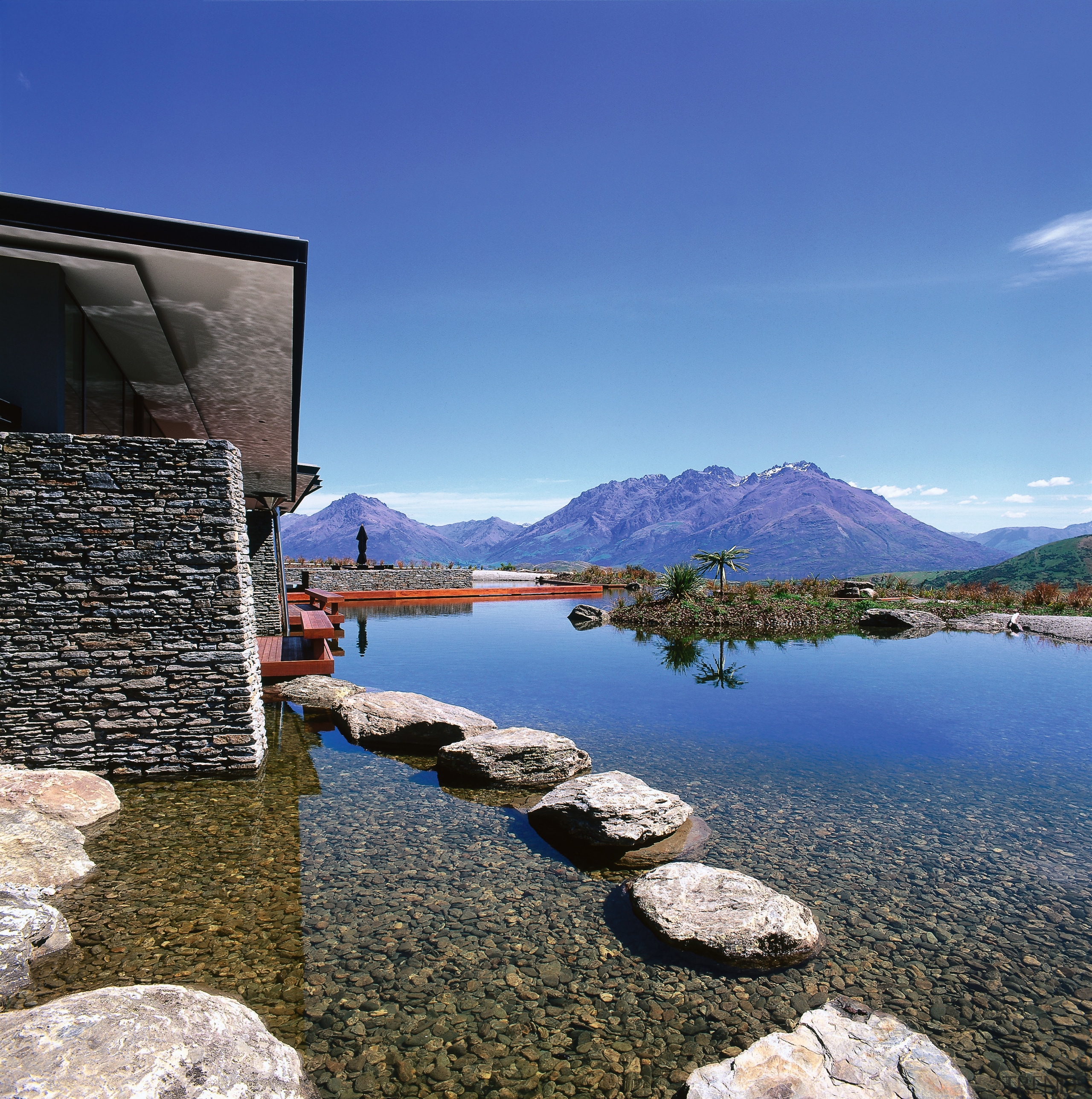 view of theis new house tucked beneath the cloud, lake, landscape, mountain, mountain range, mountainous landforms, nature, plant, reflection, rock, sky, tree, water, blue
