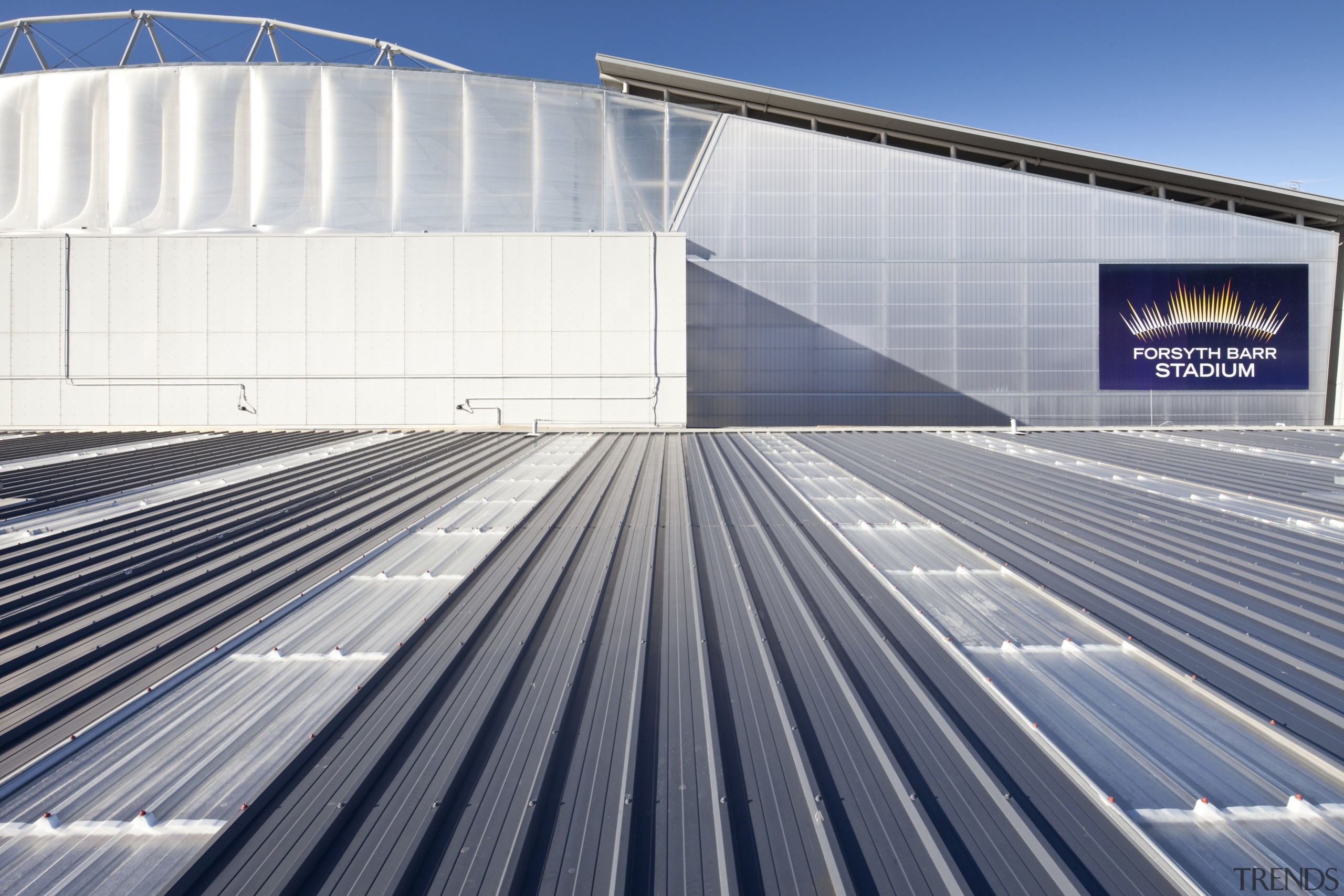 View of grey roof and grey building. - architecture, building, daylighting, energy, facade, fixed link, infrastructure, line, roof, sky, sport venue, structure, gray