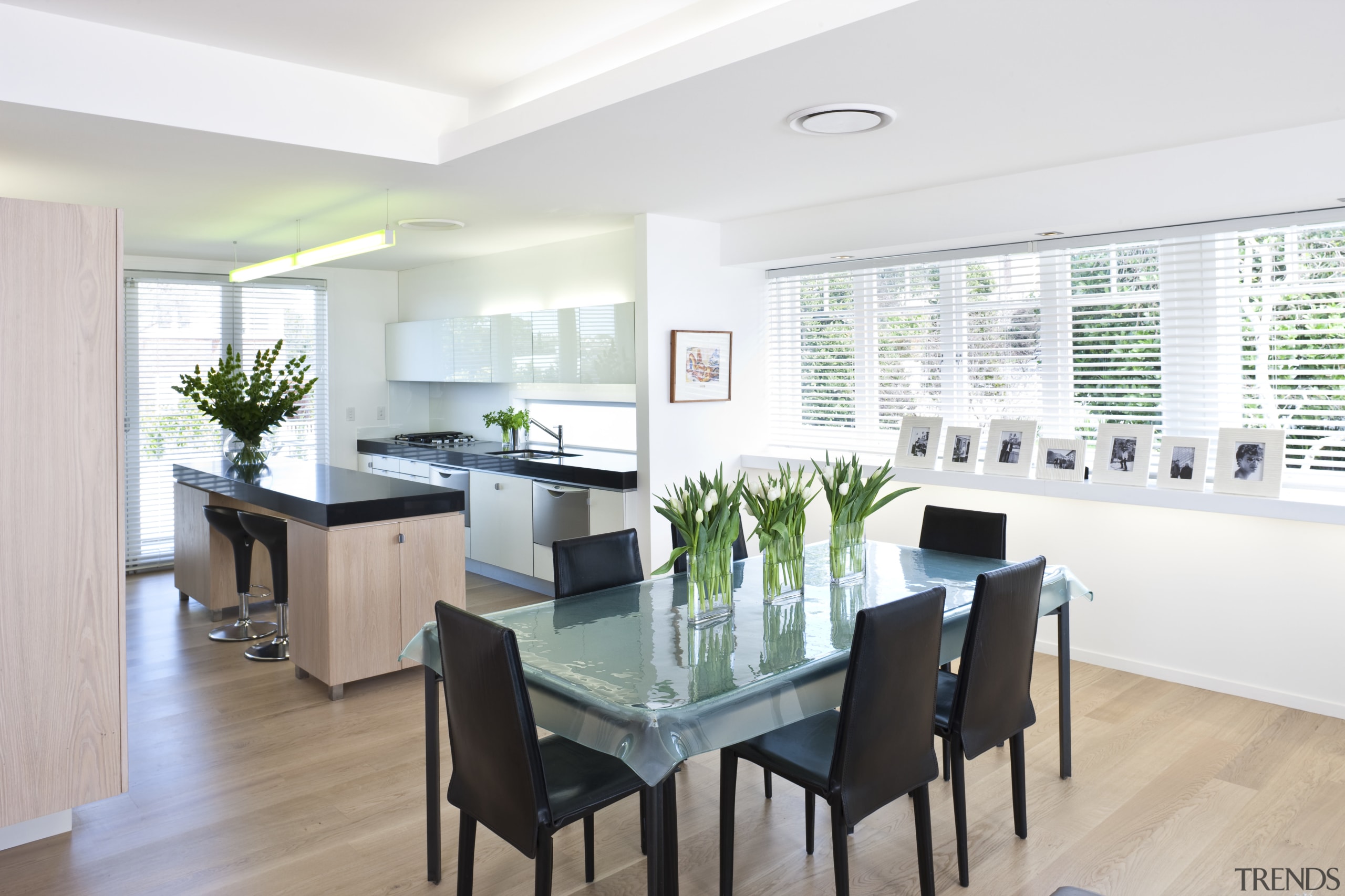 The kitchen features white stained oak cabinetry, Silestone dining room, home, interior design, kitchen, property, real estate, room, table, window, white