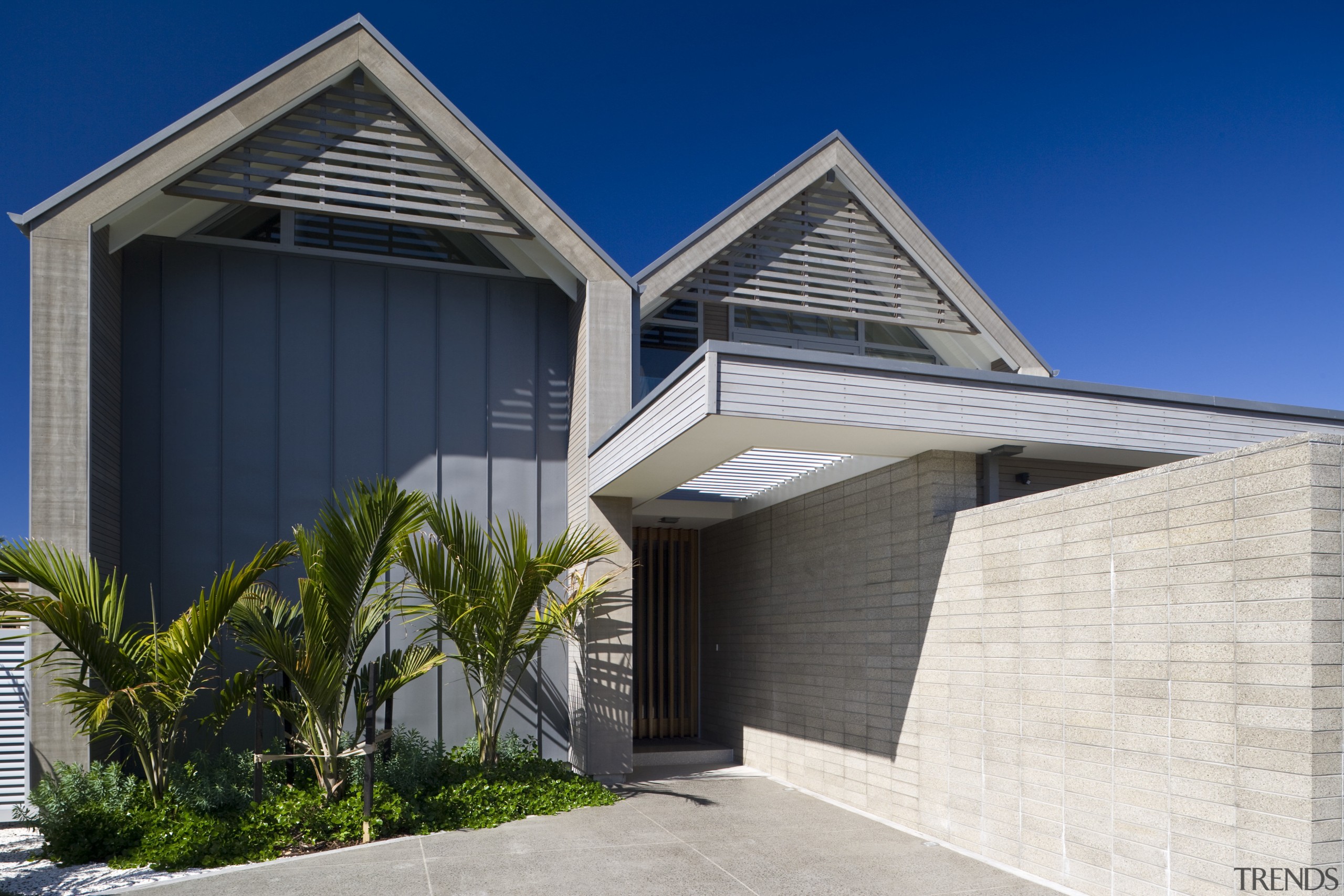Exterior view of the front entrance which is architecture, building, elevation, estate, facade, home, house, property, real estate, residential area, roof, siding, sky, blue
