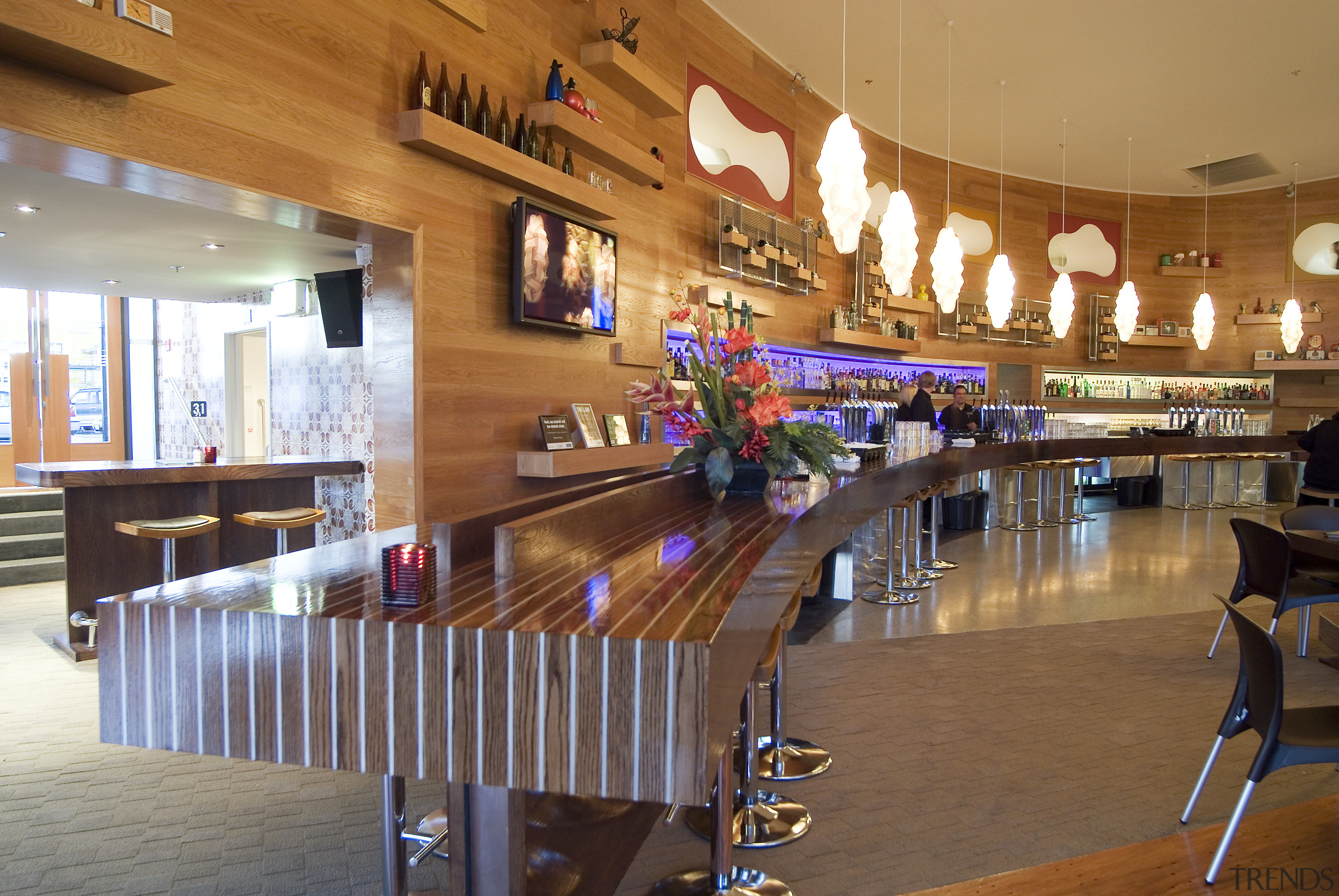 A view of a bar at Syvia Park cafeteria, function hall, interior design, lobby, restaurant, table, wood, brown