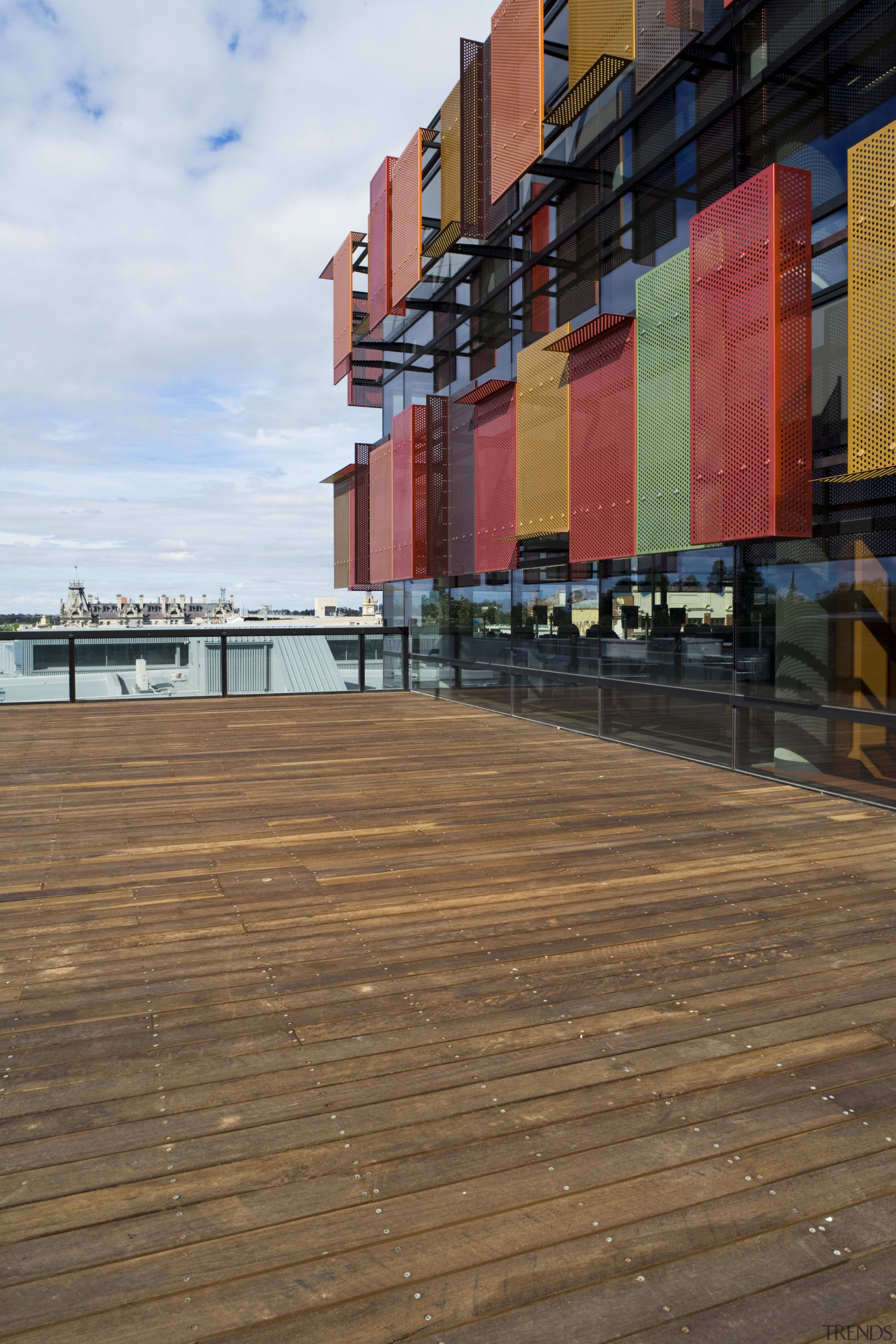 Timber flooring throughout the bank features grey ironbark architecture, boardwalk, facade, floor, flooring, reflection, sky, walkway, water, wood, brown