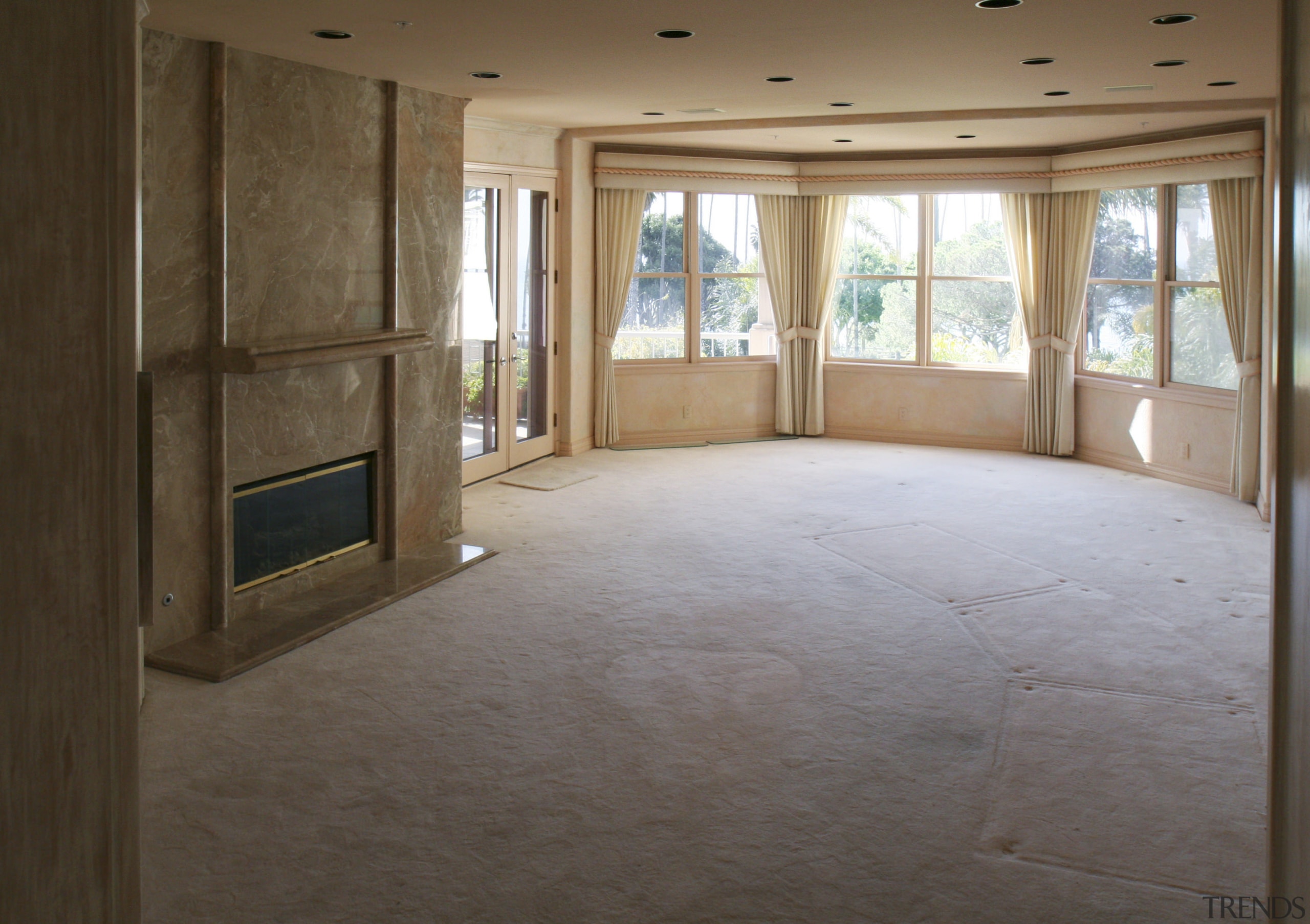 Interior view of this remodeled traditional condo by ceiling, daylighting, estate, floor, flooring, hardwood, home, house, interior design, laminate flooring, plaster, property, real estate, room, tile, wall, window, wood, wood flooring, brown, gray