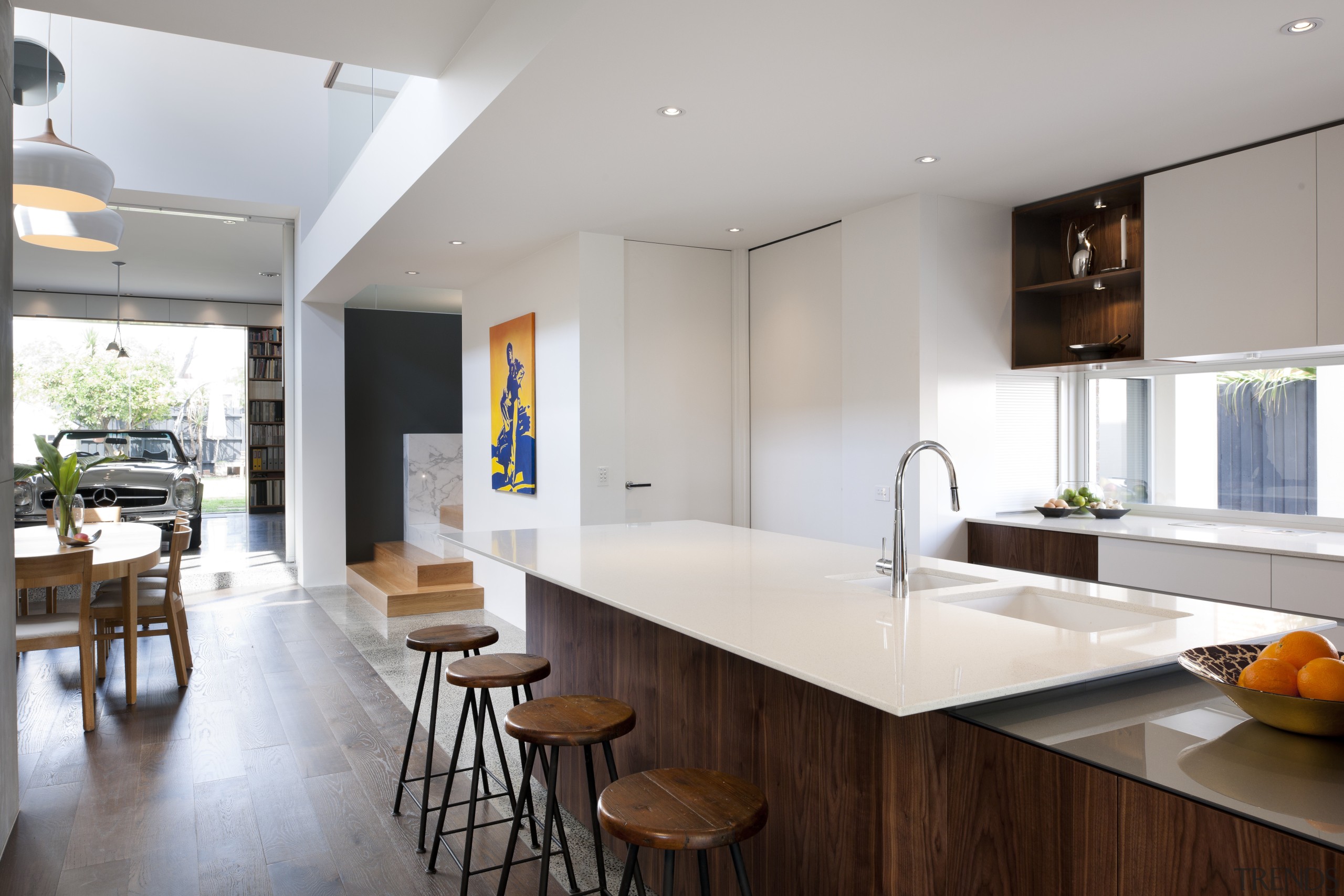 This kitchen in a contemporary home features a architecture, countertop, interior design, kitchen, real estate, gray