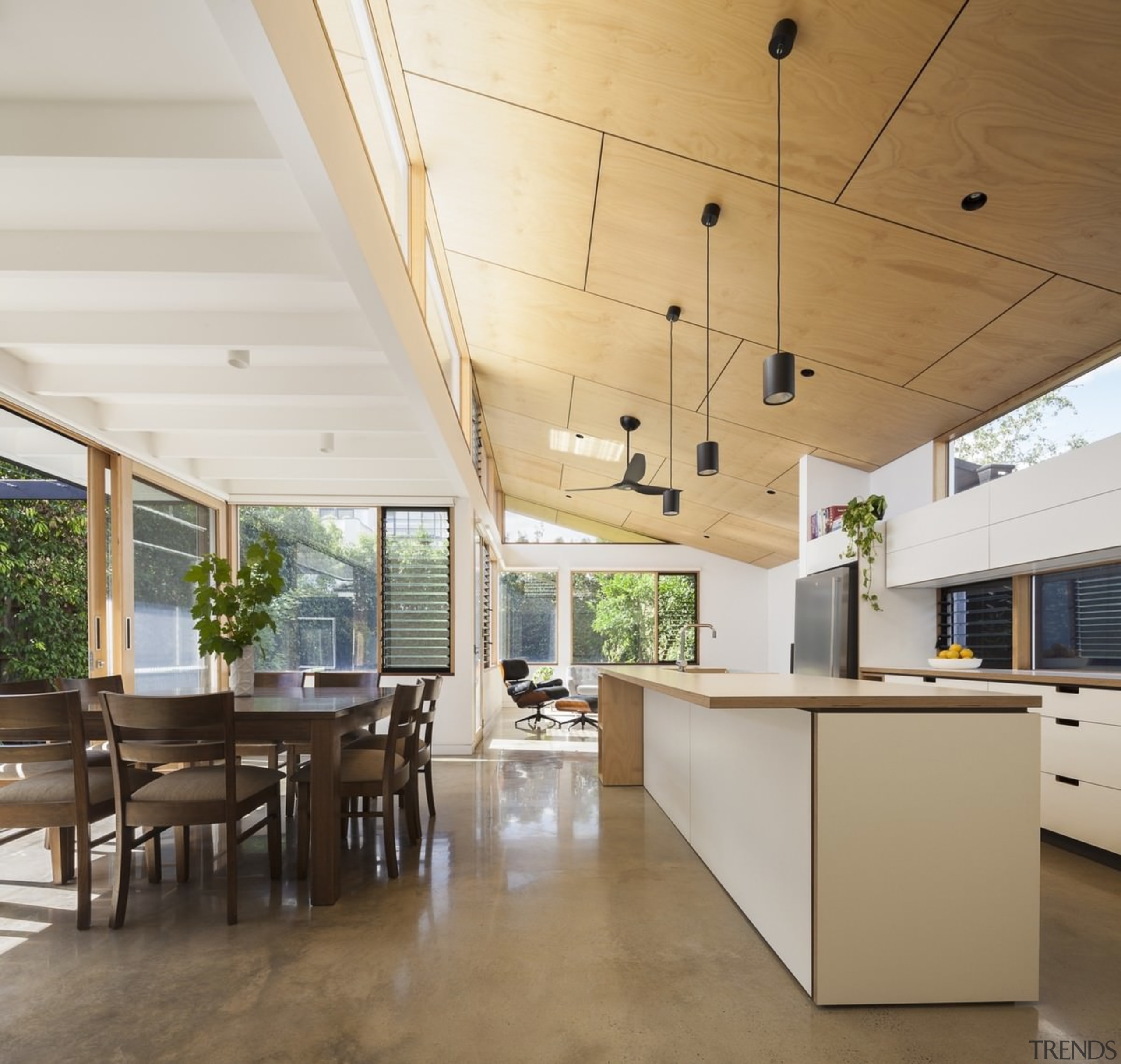 The home has a clear relationship with the architecture, ceiling, daylighting, floor, house, interior design, real estate, roof, table, white, brown