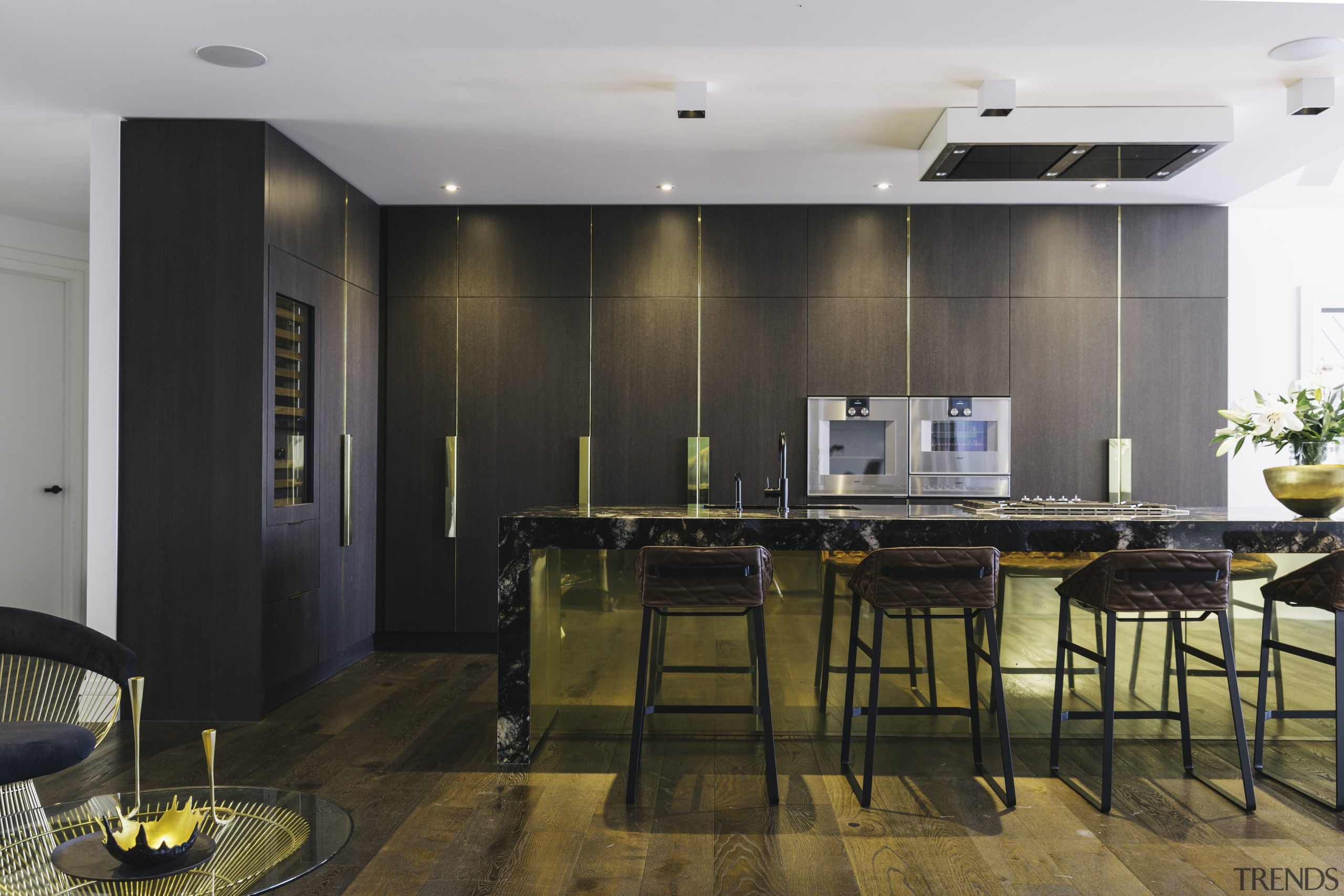 Timber veneer cabinetry and wide-plank wood floors add countertop, floor, flooring, interior design, kitchen, room, wood flooring, black