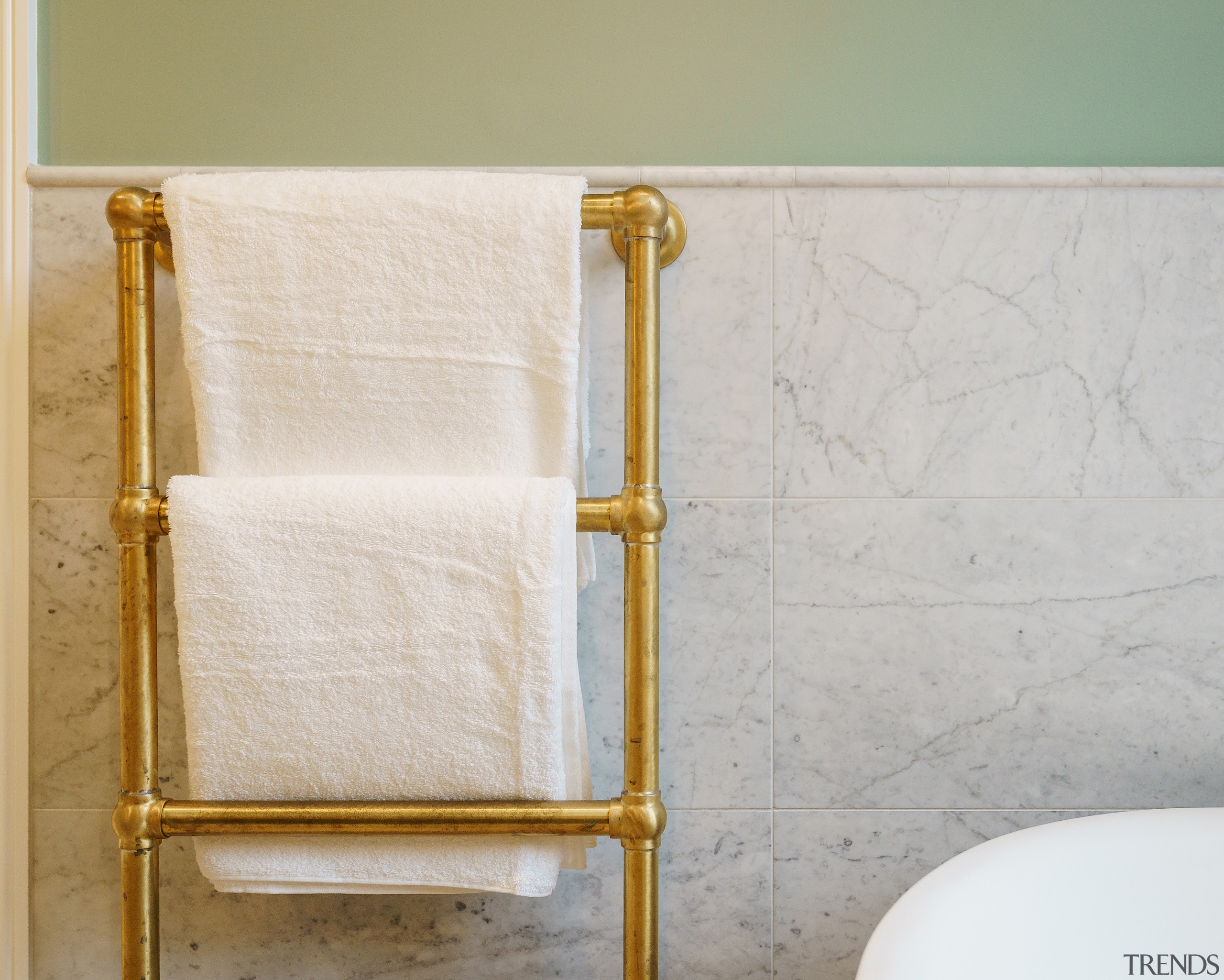 A bespoke ladder-style heated towel rail was integrated 