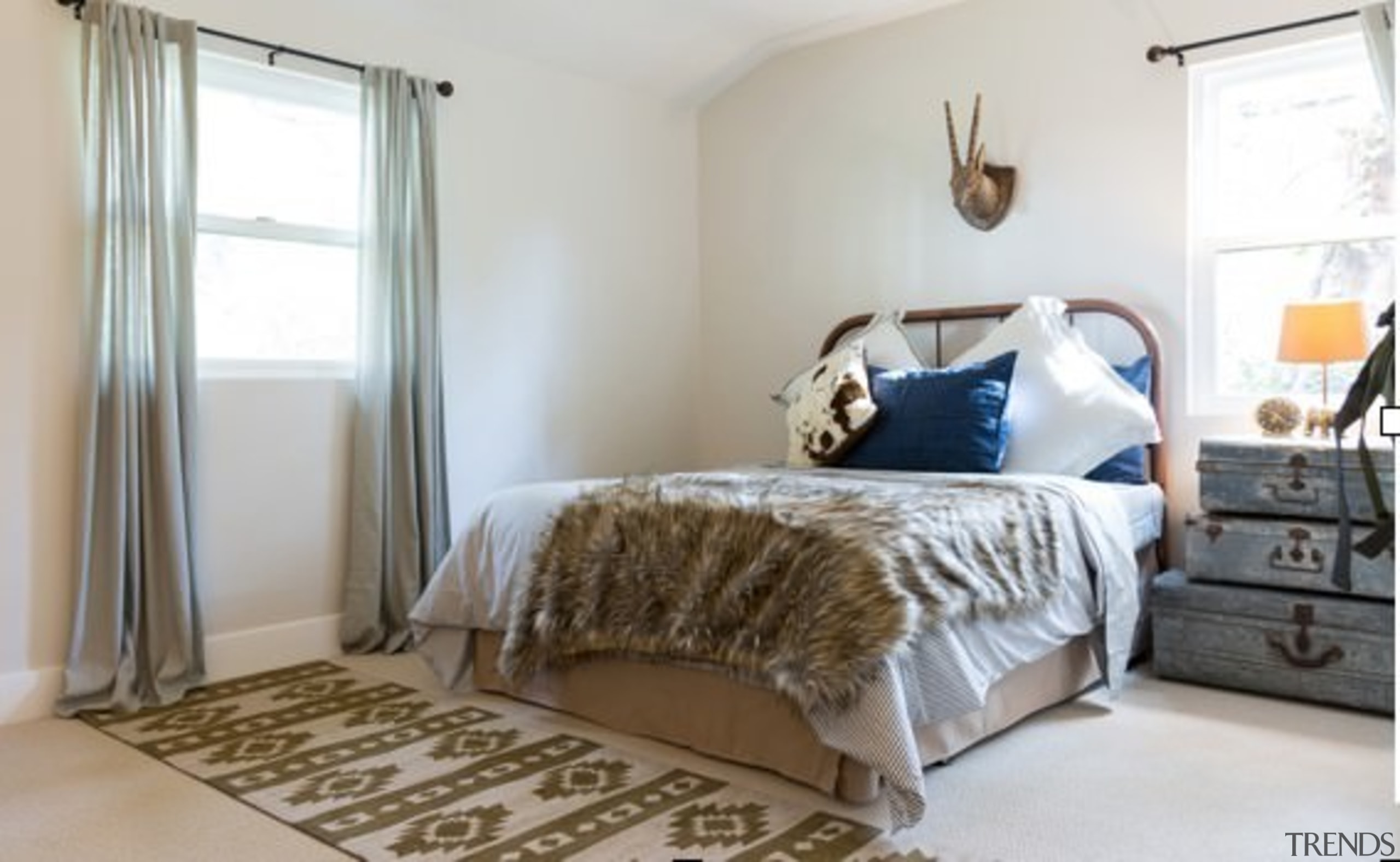 The bedroom has been subtly updated with contemporary bed, bed frame, bedroom, floor, furniture, home, interior design, property, real estate, room, wall, window, window treatment, wood, gray