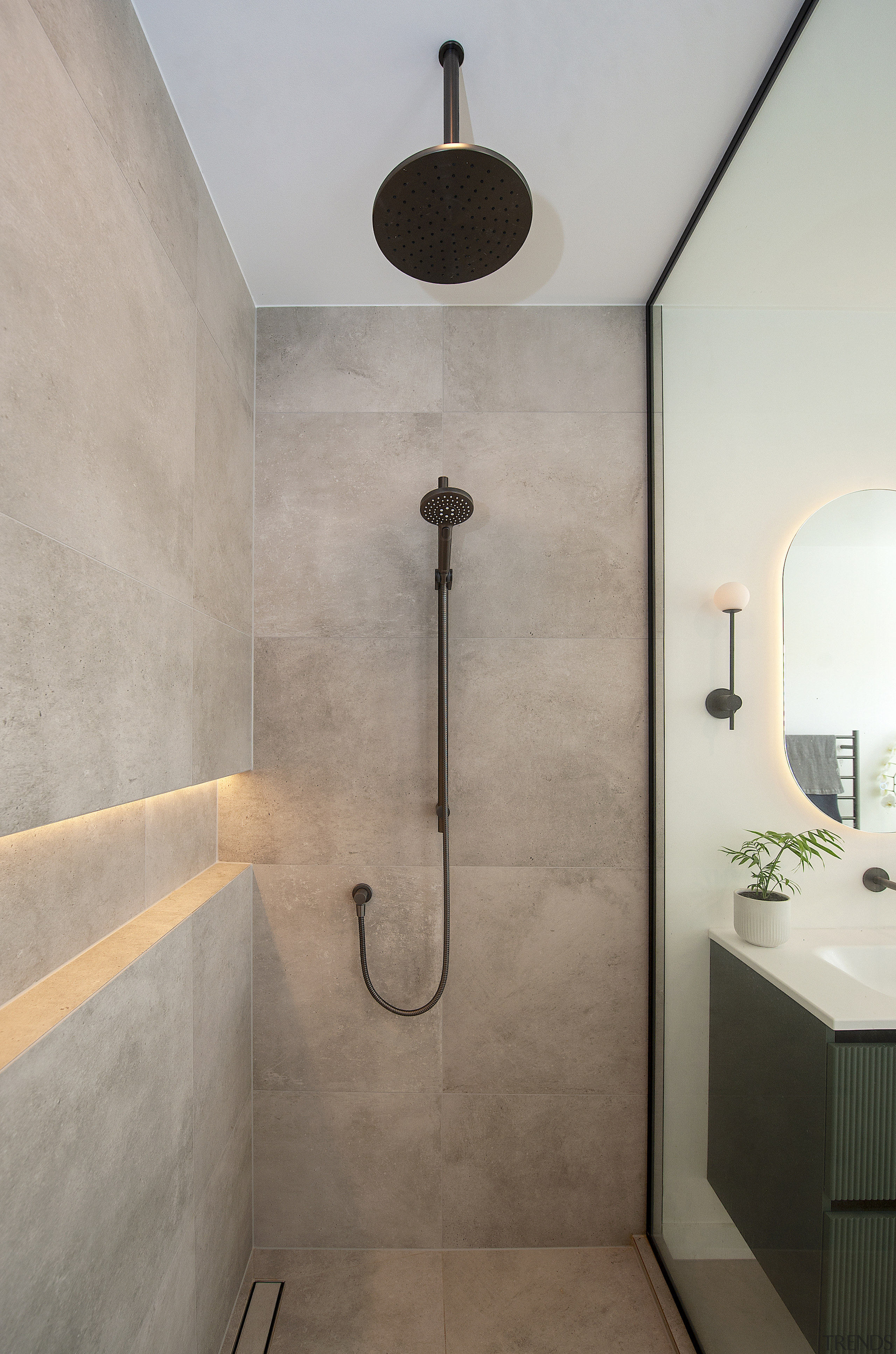 Gun Metal fixtures and an internally lit wall 