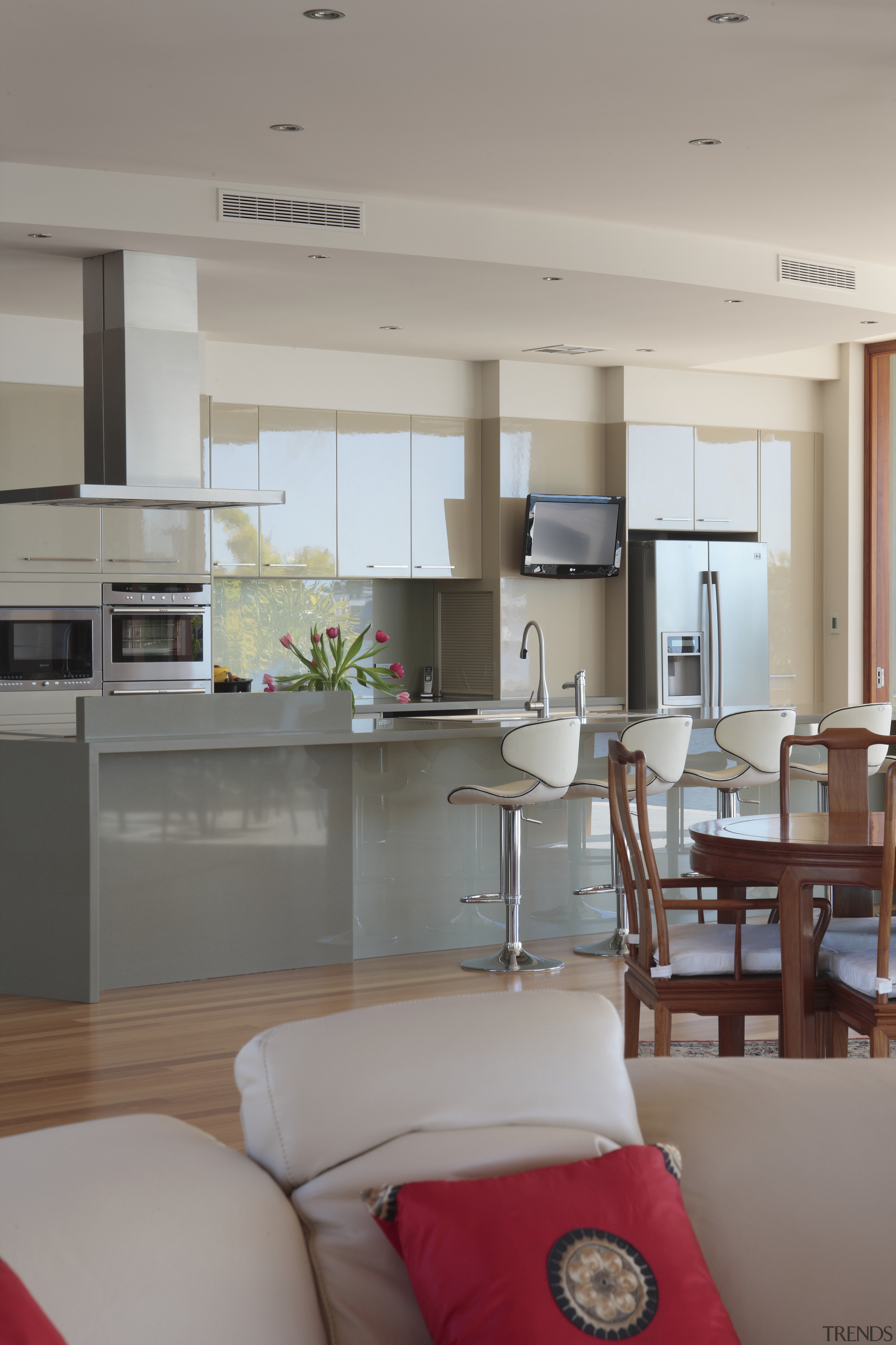 View of the kitchen area of this contemporary floor, home, interior design, kitchen, living room, room, table, gray