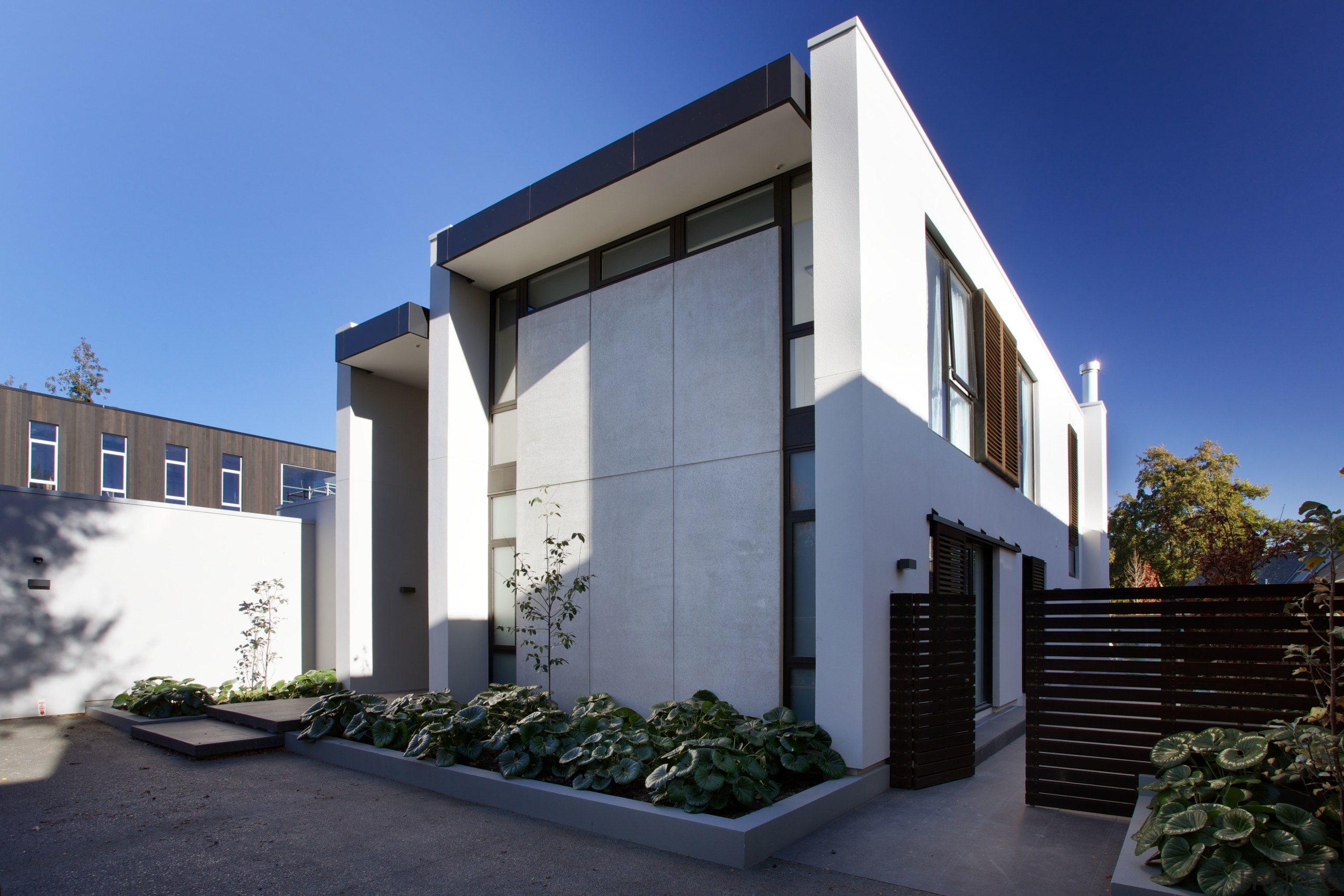 With its soaring precast concrete panels, this new architecture, building, corporate headquarters, elevation, facade, home, house, property, real estate, residential area, sky, villa, window, blue, black