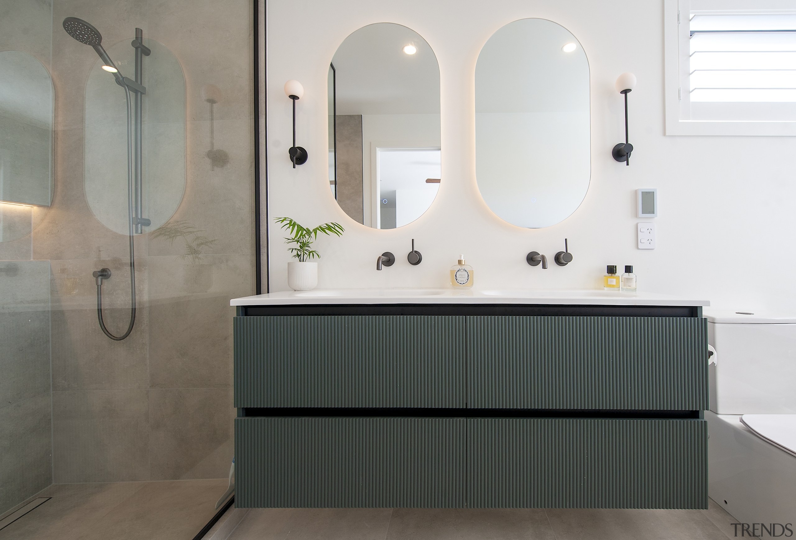 Soft, warm lighting and accent wall sconces frame 