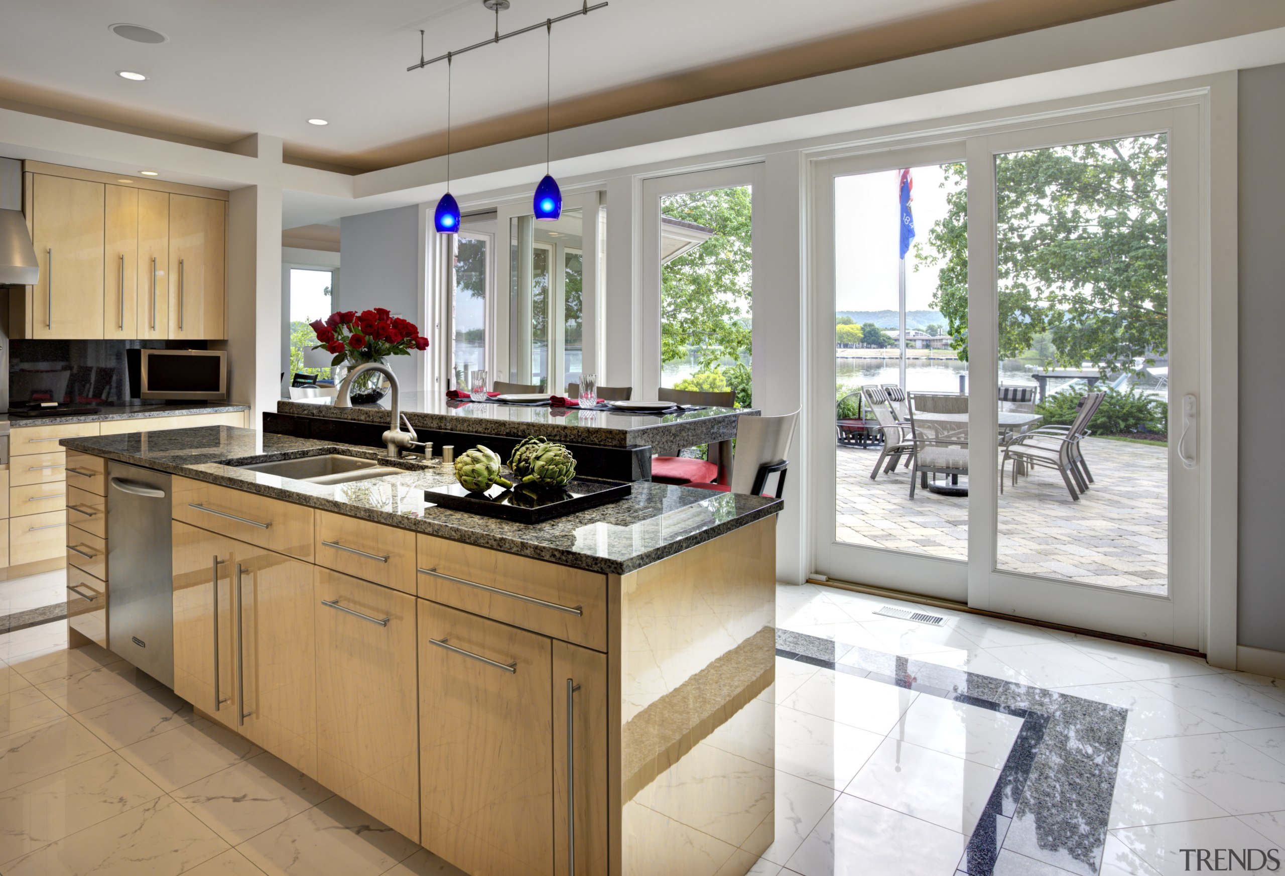 The island in this kitchen by Mary Jane countertop, cuisine classique, interior design, kitchen, real estate, window, gray