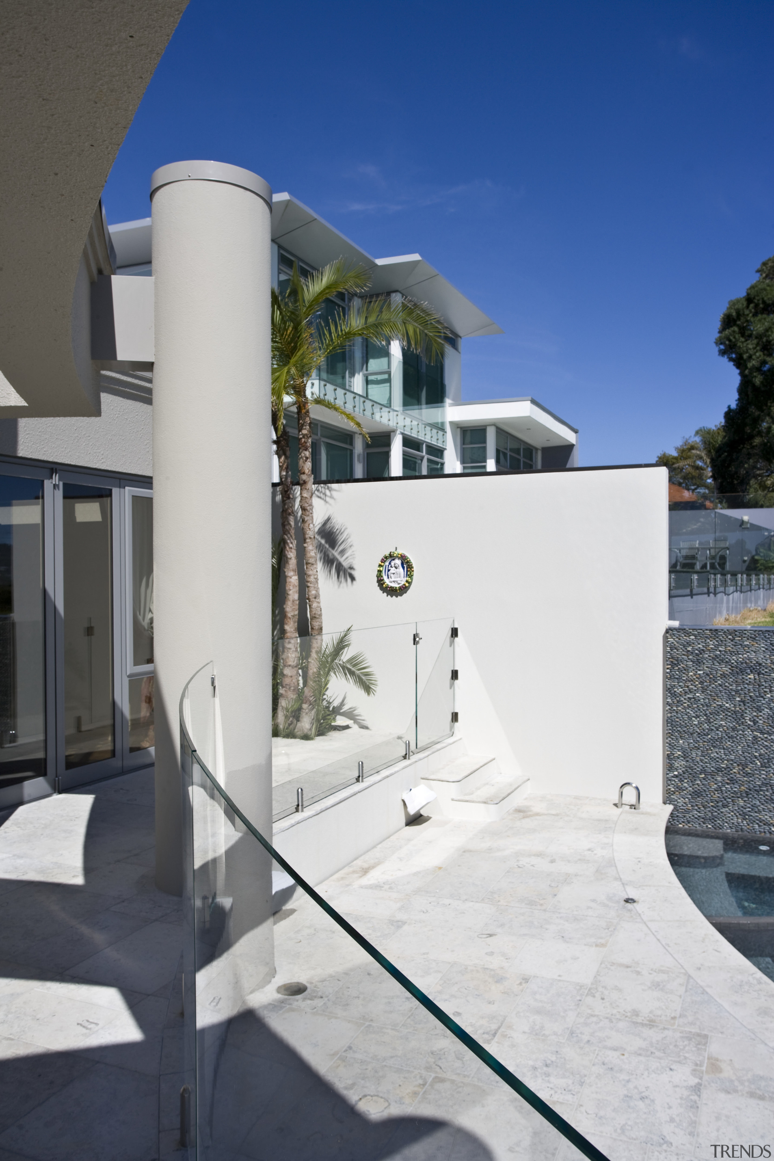 View of a curved glass balustrade from Glasshape. architecture, house, property, sky, wall, white