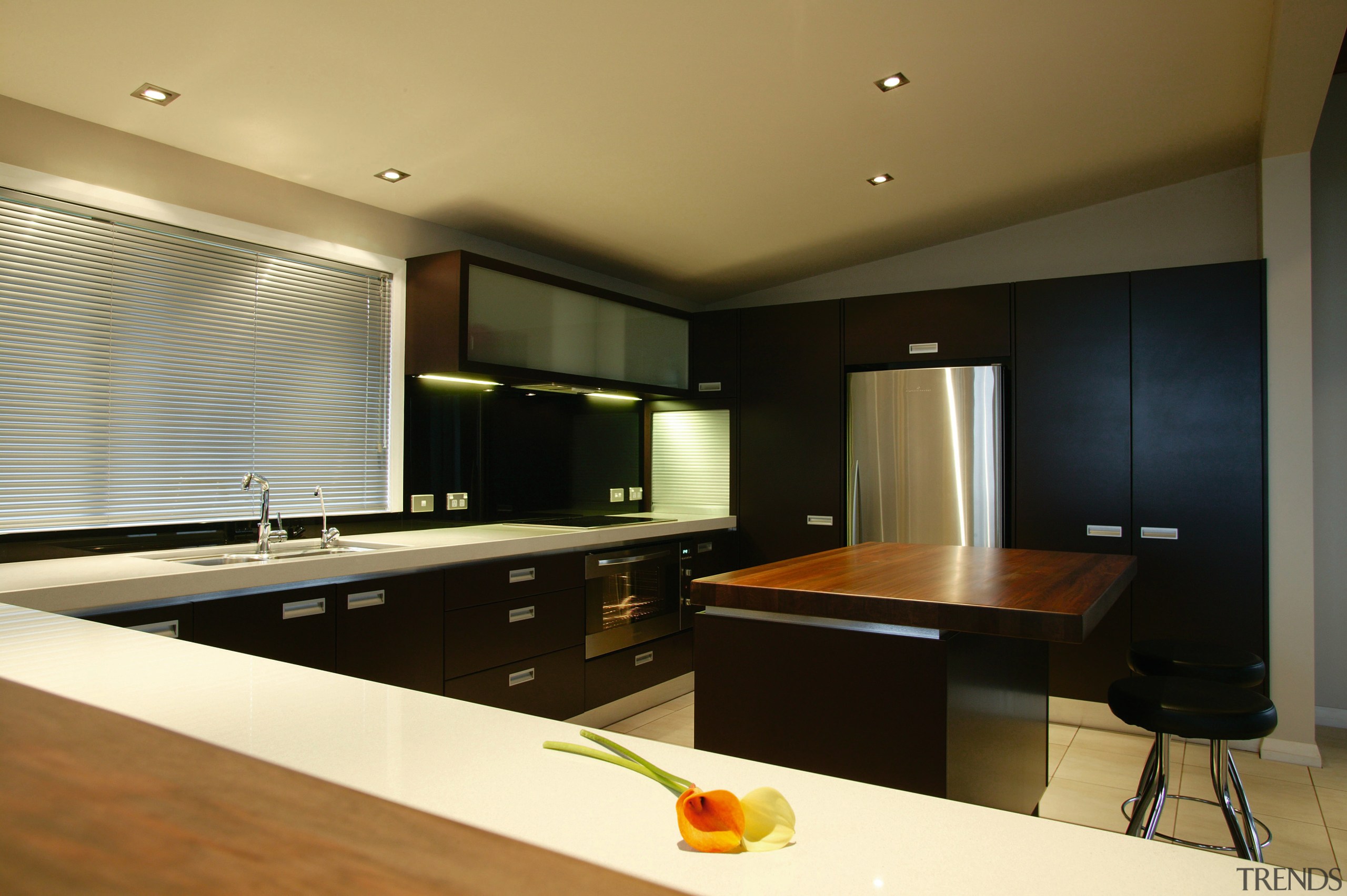 Kitchen with dark brown cabinetry and white benchtop, cabinetry, countertop, interior design, kitchen, real estate, room, under cabinet lighting, black, brown