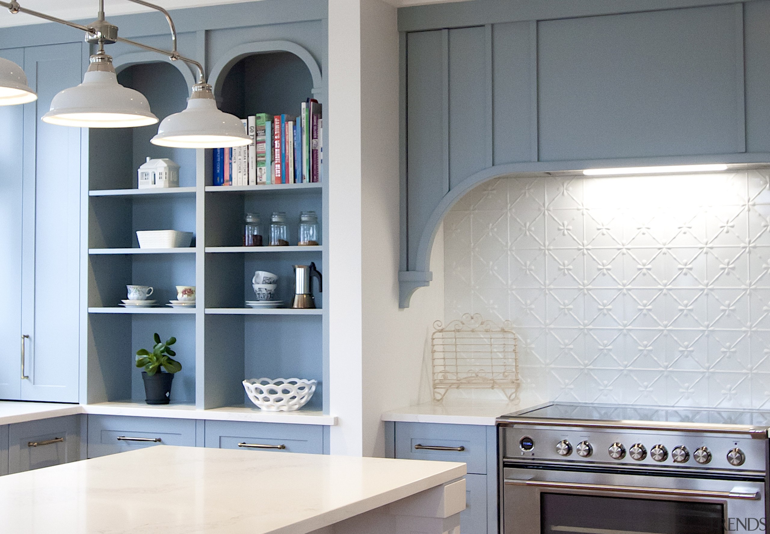 Storage is also incorporated into the classic-look rangehood. 