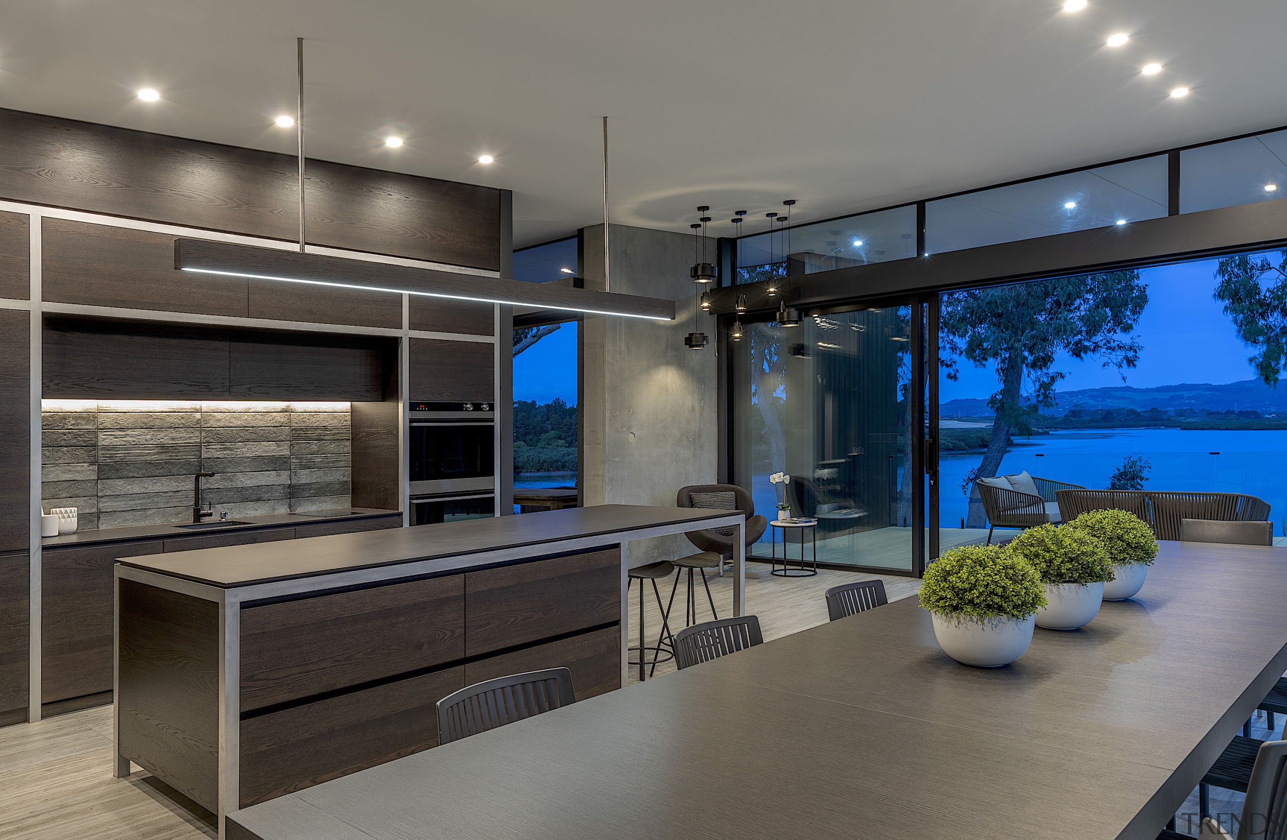 The strong interiors in this home, kitchen included, gray, black