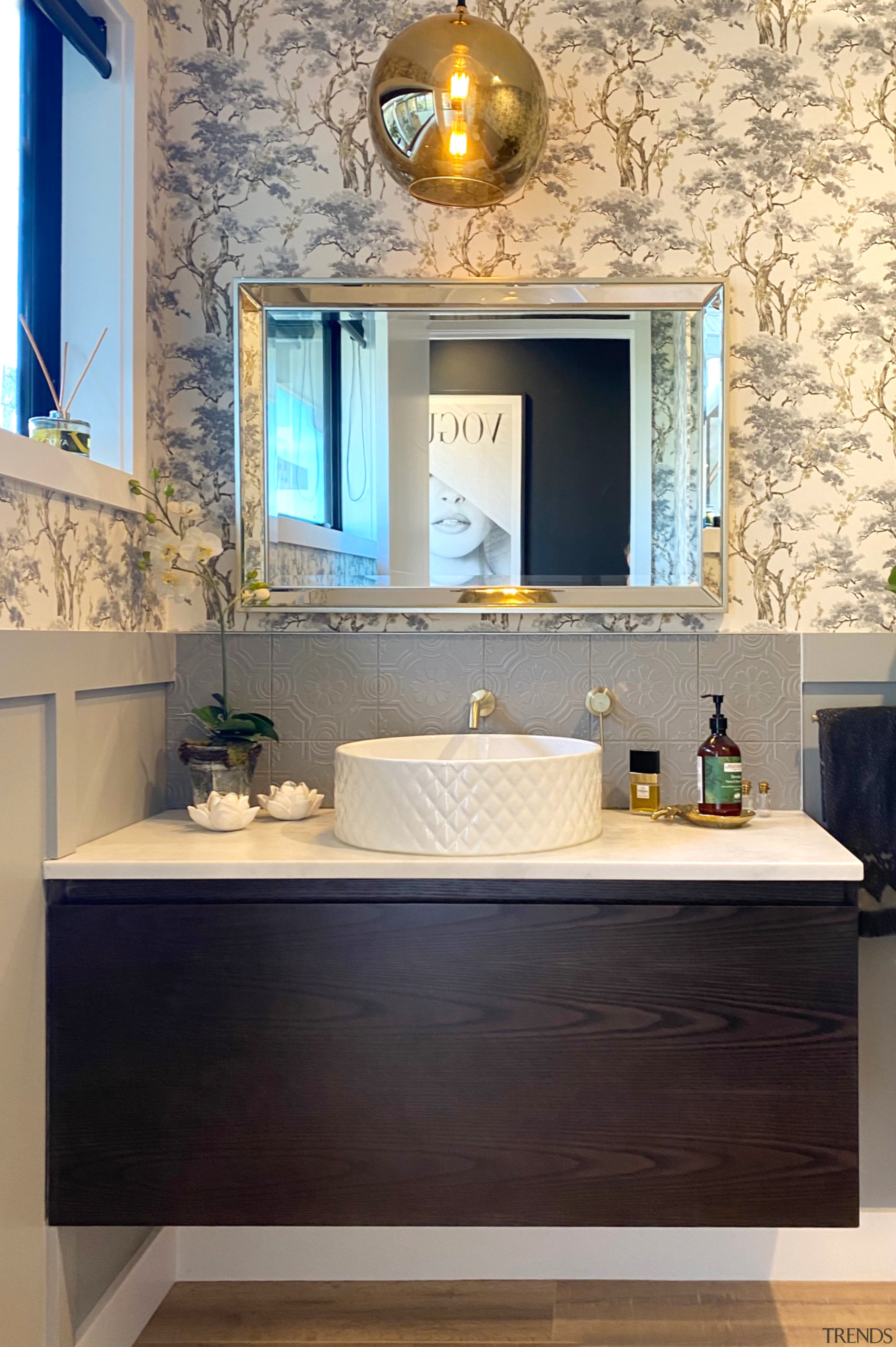 This generous powder room was designed to make 