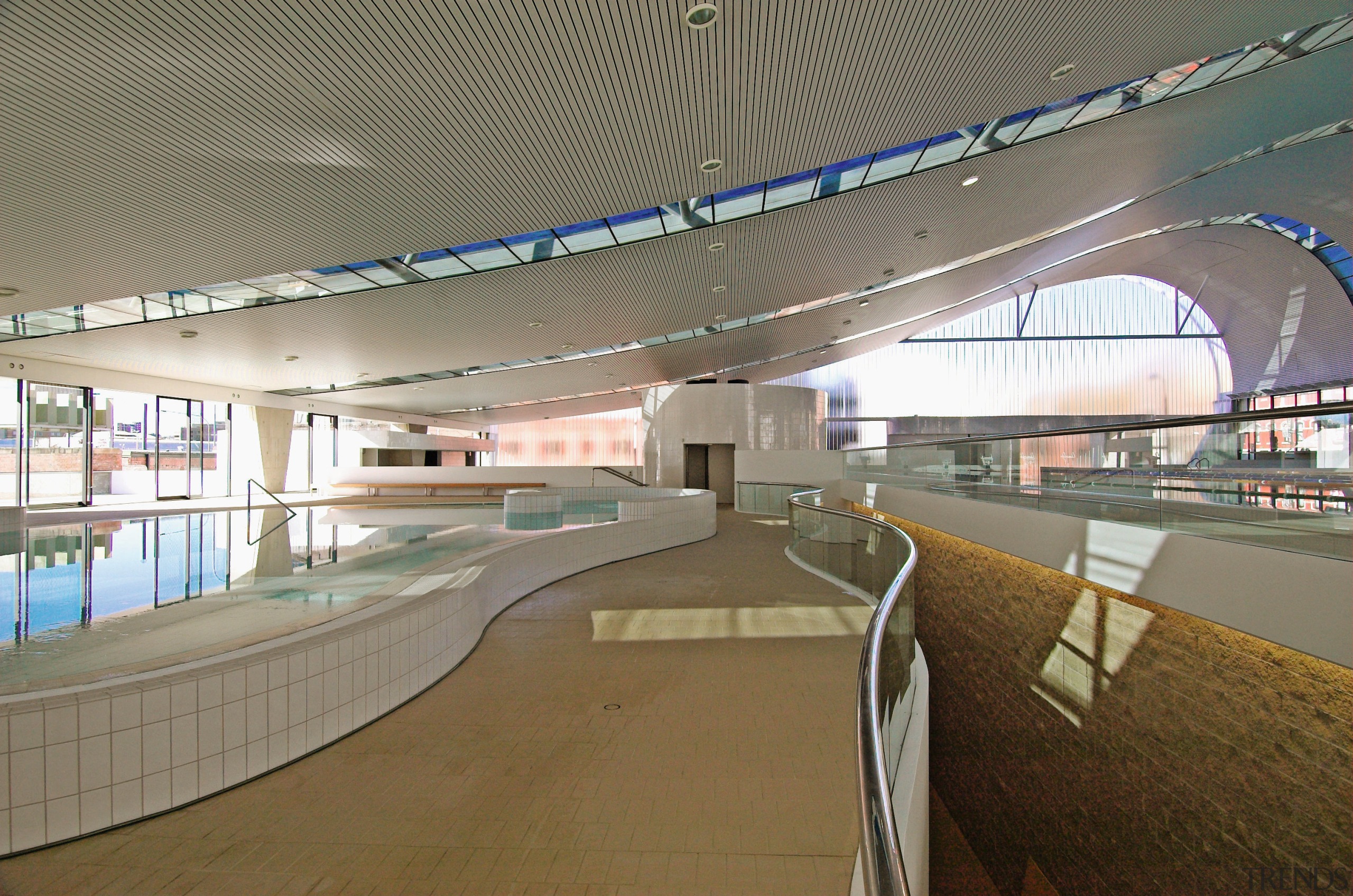 An interior view of the ian thorpe aquatic airport terminal, architecture, fixed link, infrastructure, leisure centre, metropolitan area, overpass, skyway, sport venue, structure, gray, brown