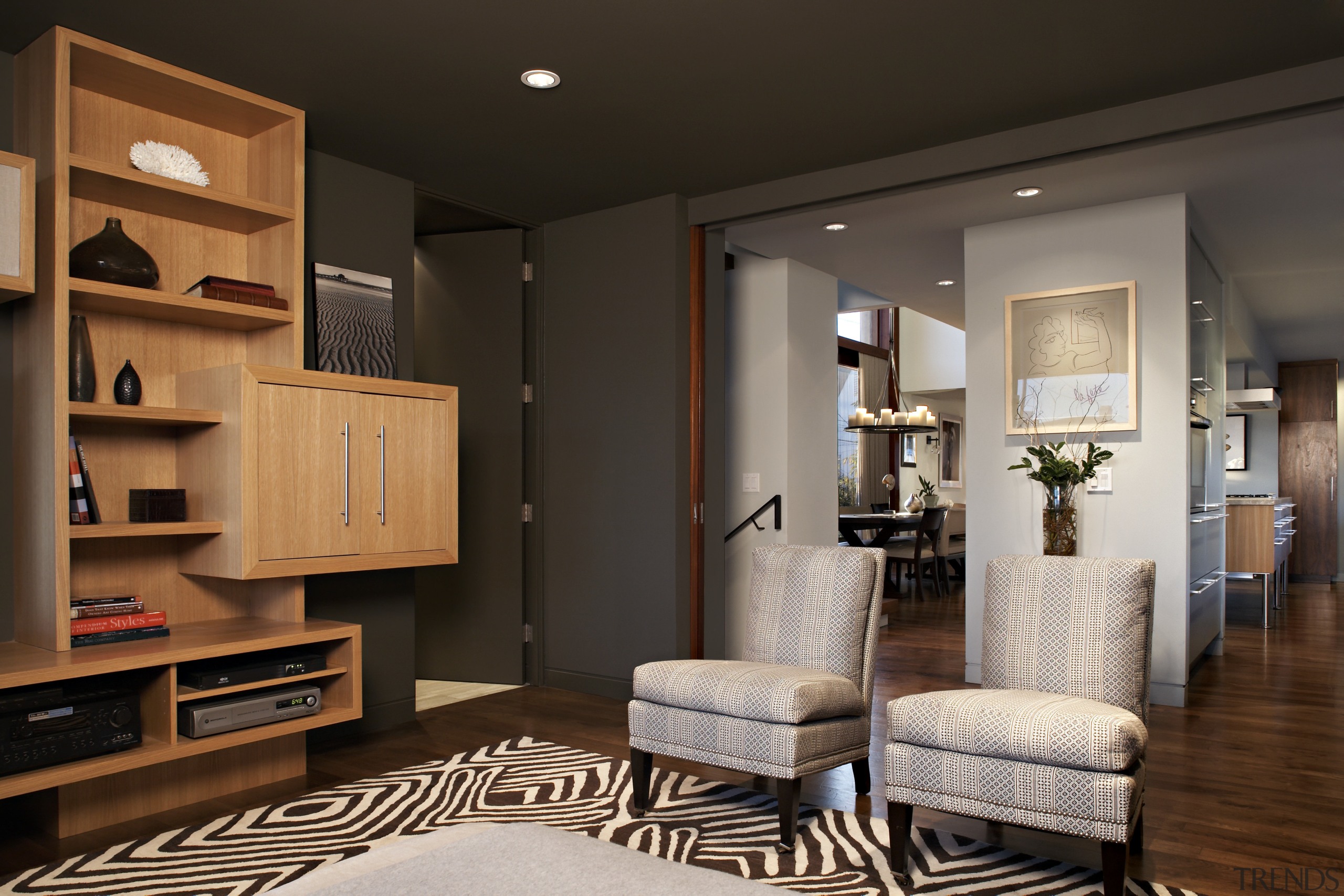 The living room ceiling features exposed beams. Custom home, interior design, living room, room, brown