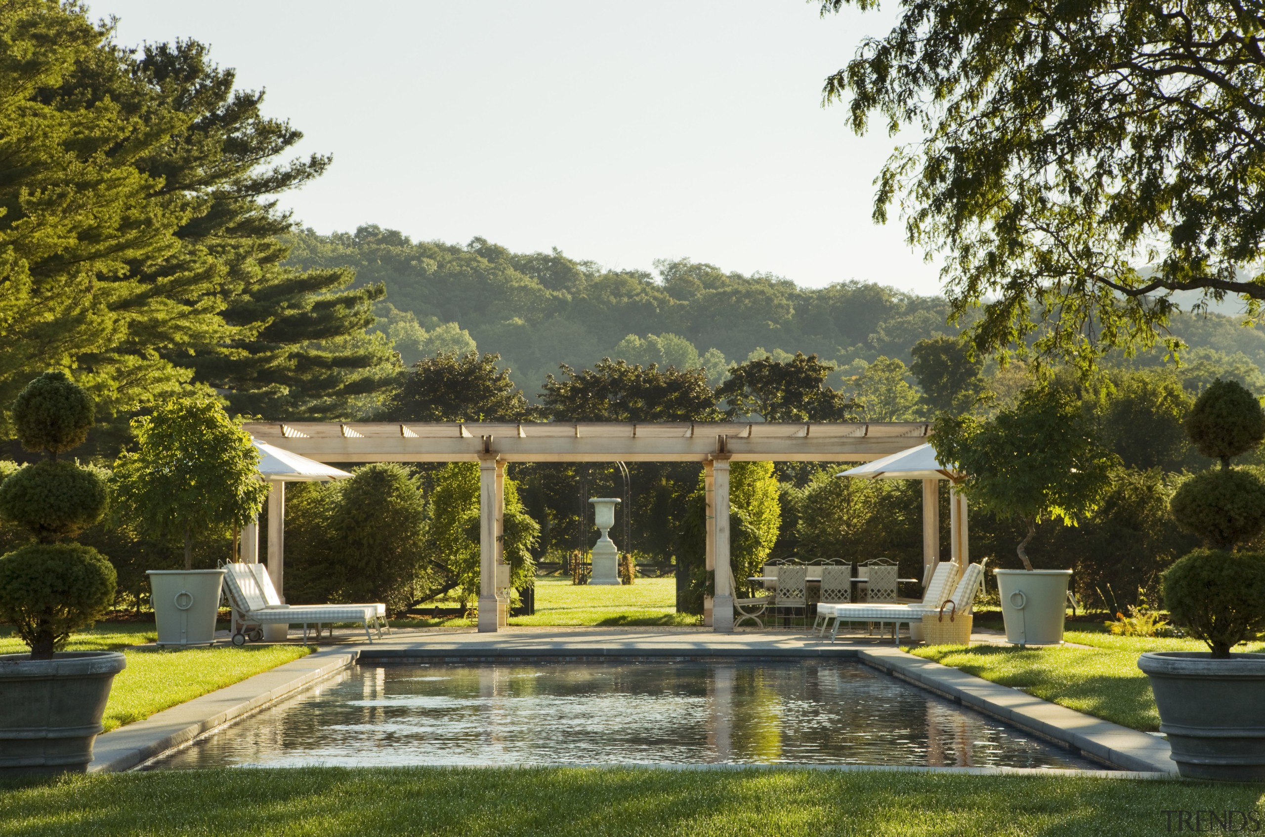 View of grand house with 18th and 19th architecture, backyard, estate, garden, grass, hacienda, home, house, landscape, landscaping, outdoor structure, plant, property, real estate, tree, villa, brown