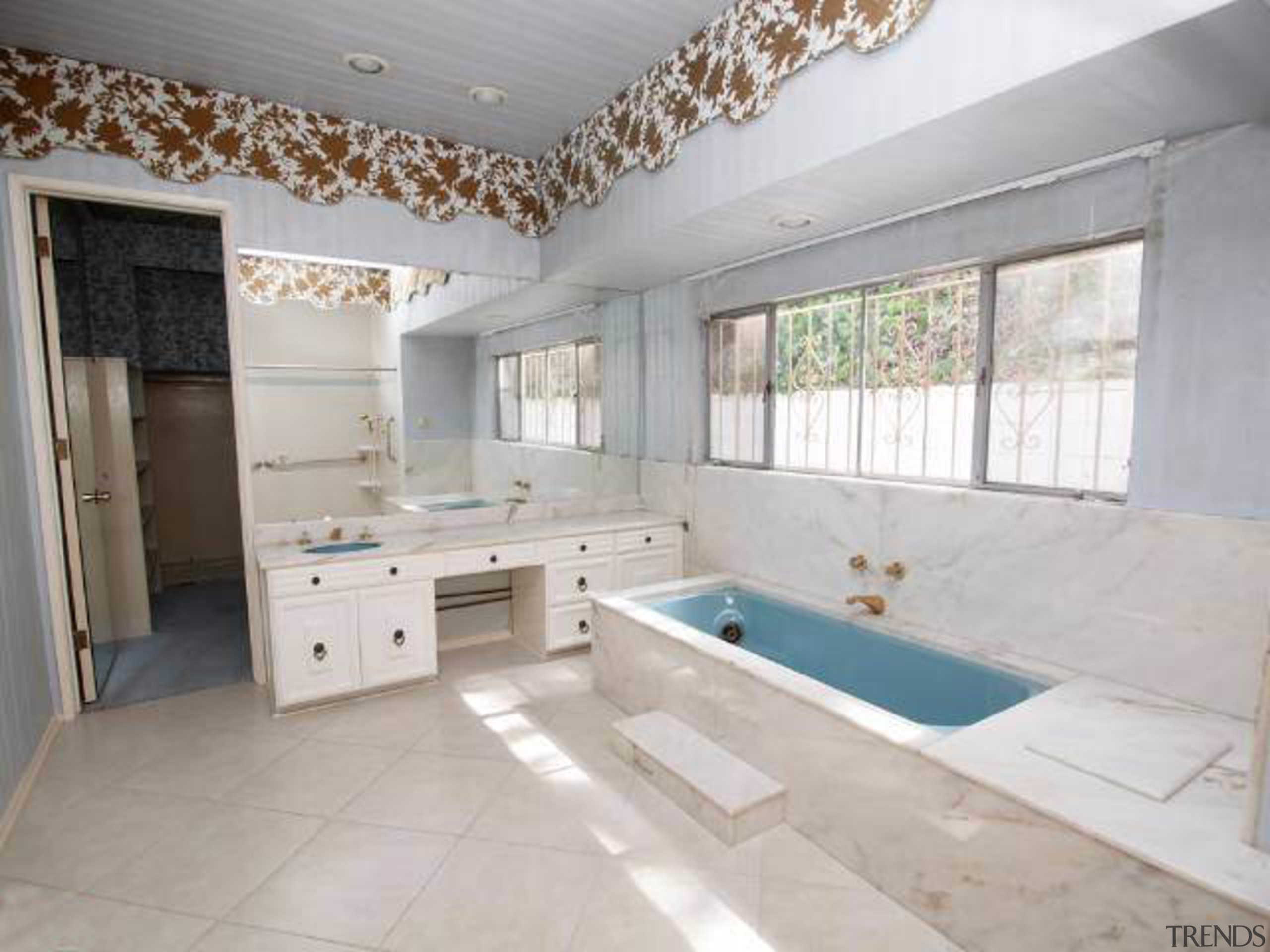 Prior to renovation, the original bathroom was tired bathroom, estate, floor, flooring, interior design, property, real estate, room, tile, gray