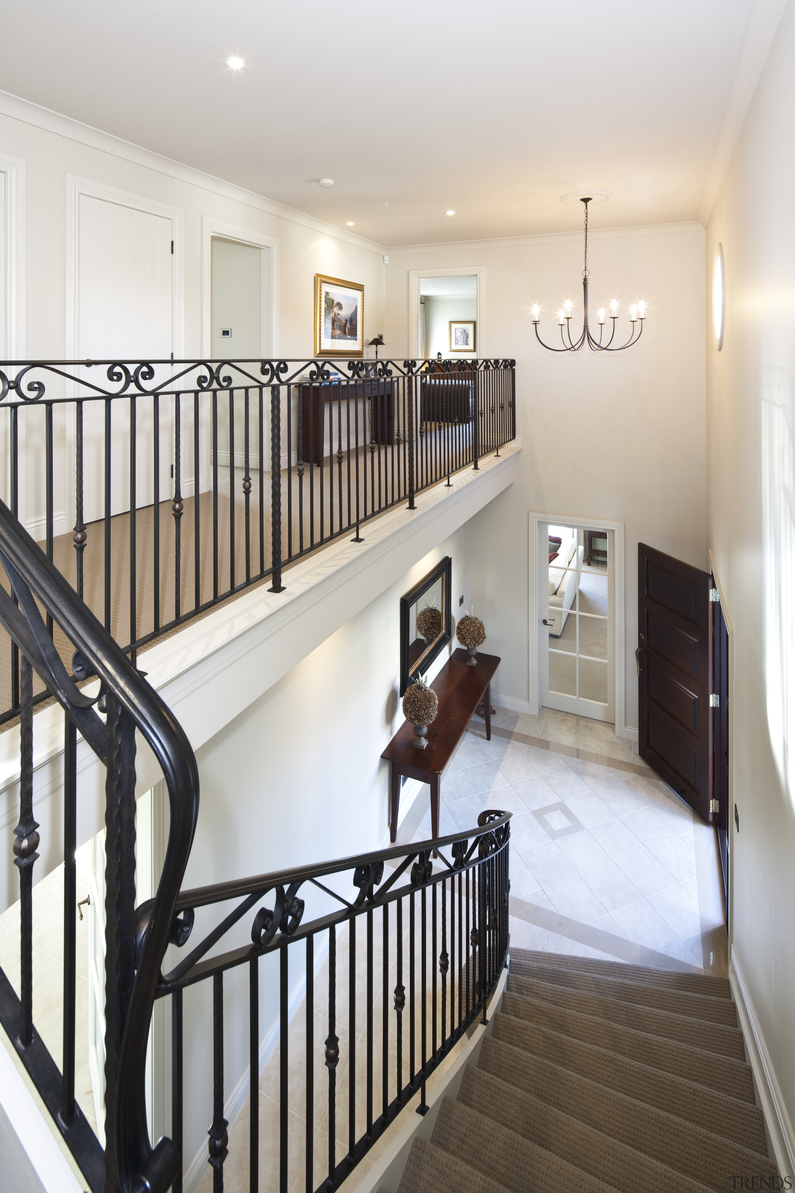 View of stairway which features iron balustrade and baluster, floor, flooring, handrail, hardwood, home, interior design, product, real estate, room, stairs, wood, white